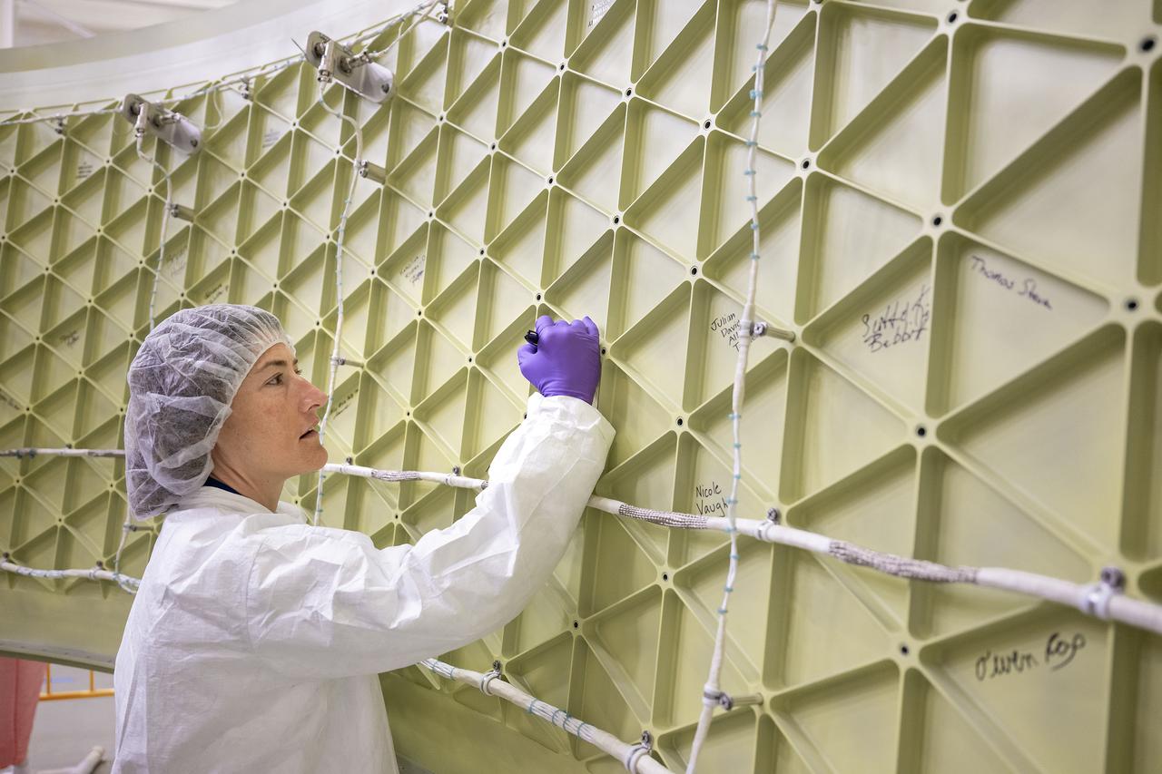 These photos show highlights from Artemis II NASA astronauts Victor Glover, Reid Wiseman, and Christina Koch of NASA and CSA (Canadian Space Agency) astronaut Jeremy Hansen visit to NASA’s Marshall Space Flight Center in Huntsville, Alabama, Nov. 27. The crew met and spoke to employees and viewed facilities for SLS (Space Launch System) rocket. All four astronauts signed the Orion stage adapter (OSA), a small ring structure that connects SLS to NASA’s Orion spacecraft, that will be used for Artemis II. Koch and Wiseman also visited the Systems Integration Lab, where SLS flight software testing is conducted. The four astronauts will launch atop SLS inside Orion to venture around the Moon on Artemis II, the first crewed flight for Artemis.