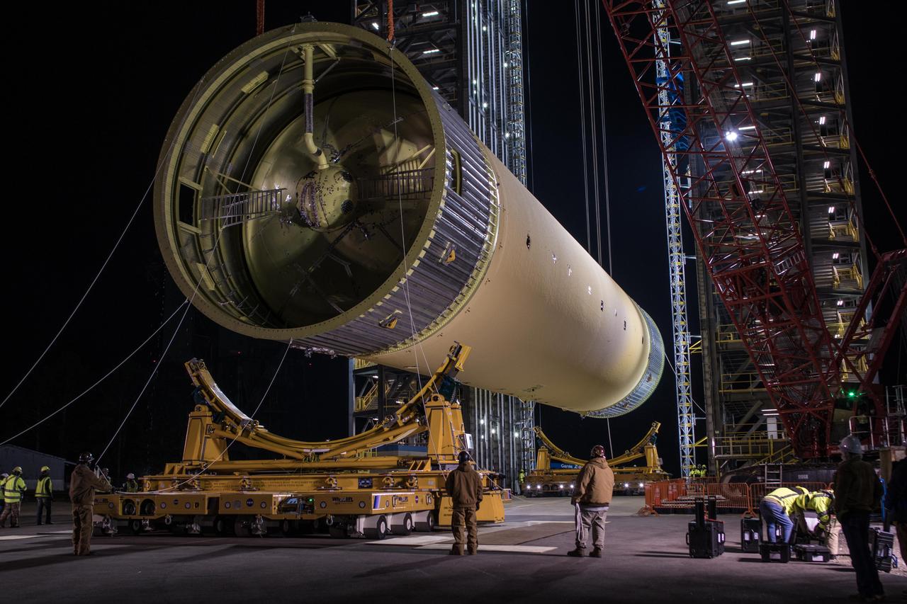 The Space Launch System (SLS) liquid hydrogen tank structural test article is loaded into Test Stand 4693 at NASA’s Marshall Space Flight Center in Huntsville, Alabama, on Jan. 14, 2019. The 149-foot piece of test hardware is the largest piece of structural hardware for the SLS core stage for America’s new deep space rocket Itis structurally identical to the flight version of the tank. It will undergo a series of tests in Test Stand 4693 to simulate the stresses and loads of liftoff and flight. These tests will help ensure designs are adequate for successful SLS missions to the Moon and beyond.