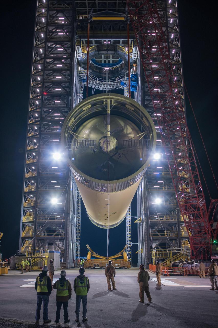 The Space Launch System (SLS) liquid hydrogen tank structural test article is loaded into Test Stand 4693 at NASA’s Marshall Space Flight Center in Huntsville, Alabama, on Jan. 14, 2019. The 149-foot piece of test hardware is the largest piece of structural hardware for the SLS core stage for America’s new deep space rocket Itis structurally identical to the flight version of the tank. It will undergo a series of tests in Test Stand 4693 to simulate the stresses and loads of liftoff and flight. These tests will help ensure designs are adequate for successful SLS missions to the Moon and beyond.