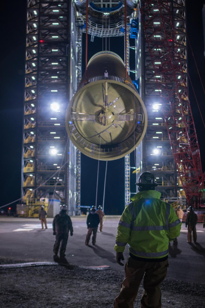 The Space Launch System (SLS) liquid hydrogen tank structural test article is loaded into Test Stand 4693 at NASA’s Marshall Space Flight Center in Huntsville, Alabama, on Jan. 14, 2019. The 149-foot piece of test hardware is the largest piece of structural hardware for the SLS core stage for America’s new deep space rocket Itis structurally identical to the flight version of the tank. It will undergo a series of tests in Test Stand 4693 to simulate the stresses and loads of liftoff and flight. These tests will help ensure designs are adequate for successful SLS missions to the Moon and beyond.