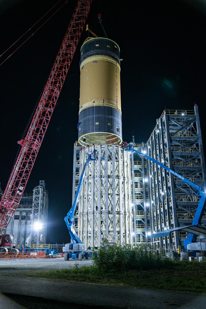 This collection of photos shows the steps NASA engineers took to lift the final structural test article for NASA’s Space Launch System (SLS) core stage into Test Stand 4697 at NASA’s Marshall Space Flight Center in Huntsville, Alabama, July 10, 2019. The liquid oxygen (LOX) tank is one of two propellant tanks in the rocket’s massive core stage that will produce more than 2 million pounds of thrust to help launch Artemis 1, the first flight of NASA’s Orion spacecraft and SLS, to the Moon. The nearly 70-foot-long liquid oxygen tank structural test article was manufactured at NASA’s Michoud Assembly Facility in New Orleans and delivered by NASA’s barge Pegasus to Marshall. Once bolted into the test stand, dozens of hydraulic cylinders will push and pull the tank, subjecting it to the same stresses and forces it will endure during liftoff and flight, to verify it is fit for flight.