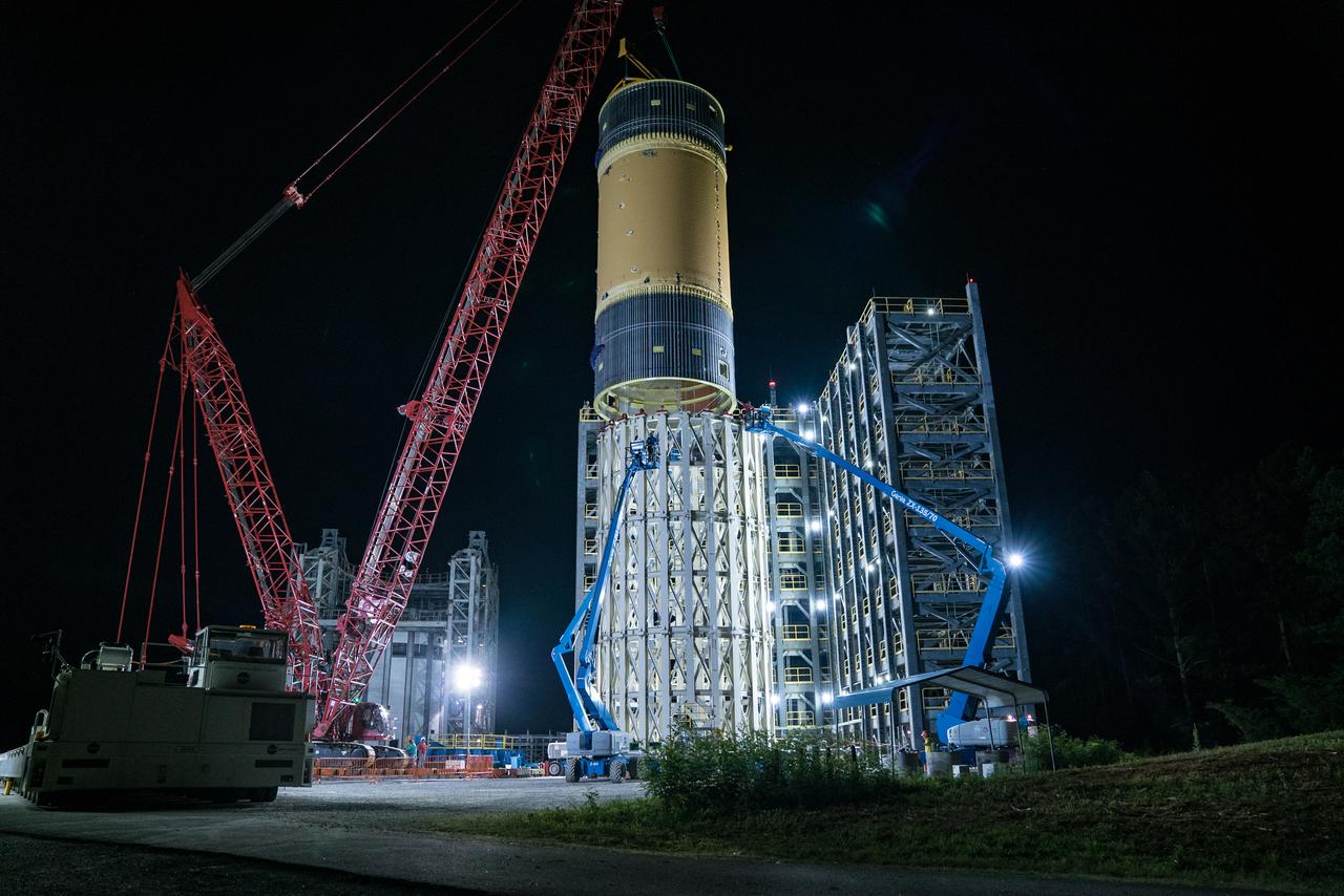 This collection of photos shows the steps NASA engineers took to lift the final structural test article for NASA’s Space Launch System (SLS) core stage into Test Stand 4697 at NASA’s Marshall Space Flight Center in Huntsville, Alabama, July 10, 2019. The liquid oxygen (LOX) tank is one of two propellant tanks in the rocket’s massive core stage that will produce more than 2 million pounds of thrust to help launch Artemis 1, the first flight of NASA’s Orion spacecraft and SLS, to the Moon. The nearly 70-foot-long liquid oxygen tank structural test article was manufactured at NASA’s Michoud Assembly Facility in New Orleans and delivered by NASA’s barge Pegasus to Marshall. Once bolted into the test stand, dozens of hydraulic cylinders will push and pull the tank, subjecting it to the same stresses and forces it will endure during liftoff and flight, to verify it is fit for flight.