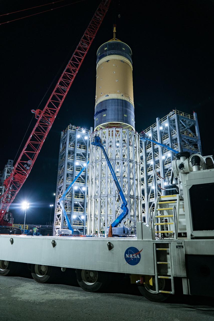 This collection of photos shows the steps NASA engineers took to lift the final structural test article for NASA’s Space Launch System (SLS) core stage into Test Stand 4697 at NASA’s Marshall Space Flight Center in Huntsville, Alabama, July 10, 2019. The liquid oxygen (LOX) tank is one of two propellant tanks in the rocket’s massive core stage that will produce more than 2 million pounds of thrust to help launch Artemis 1, the first flight of NASA’s Orion spacecraft and SLS, to the Moon. The nearly 70-foot-long liquid oxygen tank structural test article was manufactured at NASA’s Michoud Assembly Facility in New Orleans and delivered by NASA’s barge Pegasus to Marshall. Once bolted into the test stand, dozens of hydraulic cylinders will push and pull the tank, subjecting it to the same stresses and forces it will endure during liftoff and flight, to verify it is fit for flight.