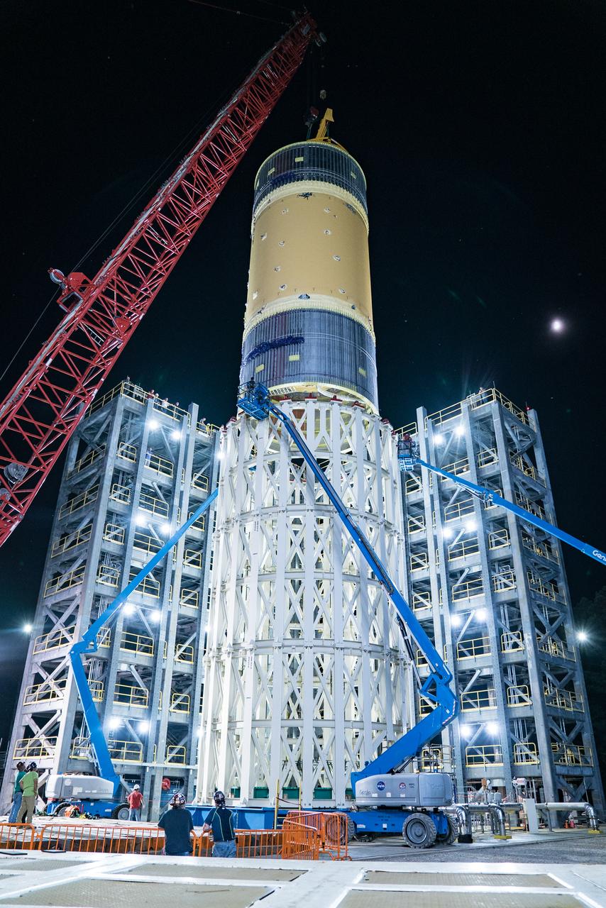 This collection of photos shows the steps NASA engineers took to lift the final structural test article for NASA’s Space Launch System (SLS) core stage into Test Stand 4697 at NASA’s Marshall Space Flight Center in Huntsville, Alabama, July 10, 2019. The liquid oxygen (LOX) tank is one of two propellant tanks in the rocket’s massive core stage that will produce more than 2 million pounds of thrust to help launch Artemis 1, the first flight of NASA’s Orion spacecraft and SLS, to the Moon. The nearly 70-foot-long liquid oxygen tank structural test article was manufactured at NASA’s Michoud Assembly Facility in New Orleans and delivered by NASA’s barge Pegasus to Marshall. Once bolted into the test stand, dozens of hydraulic cylinders will push and pull the tank, subjecting it to the same stresses and forces it will endure during liftoff and flight, to verify it is fit for flight.
