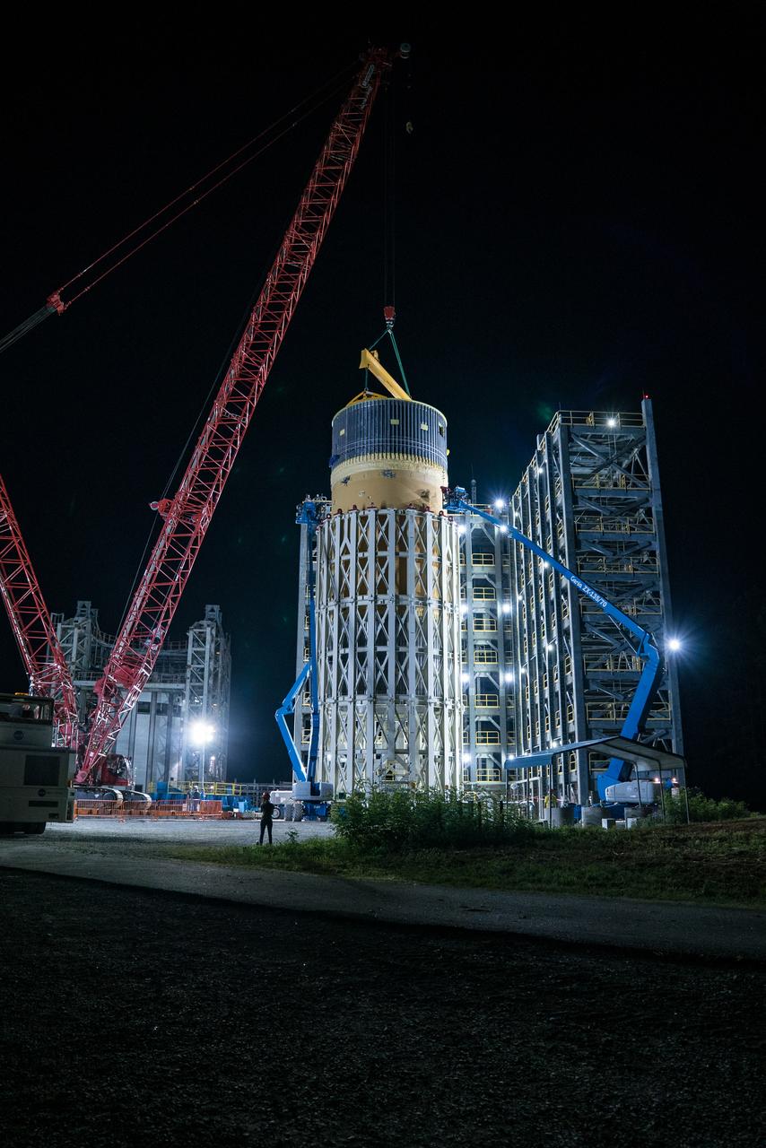 This collection of photos shows the steps NASA engineers took to lift the final structural test article for NASA’s Space Launch System (SLS) core stage into Test Stand 4697 at NASA’s Marshall Space Flight Center in Huntsville, Alabama, July 10, 2019. The liquid oxygen (LOX) tank is one of two propellant tanks in the rocket’s massive core stage that will produce more than 2 million pounds of thrust to help launch Artemis 1, the first flight of NASA’s Orion spacecraft and SLS, to the Moon. The nearly 70-foot-long liquid oxygen tank structural test article was manufactured at NASA’s Michoud Assembly Facility in New Orleans and delivered by NASA’s barge Pegasus to Marshall. Once bolted into the test stand, dozens of hydraulic cylinders will push and pull the tank, subjecting it to the same stresses and forces it will endure during liftoff and flight, to verify it is fit for flight.