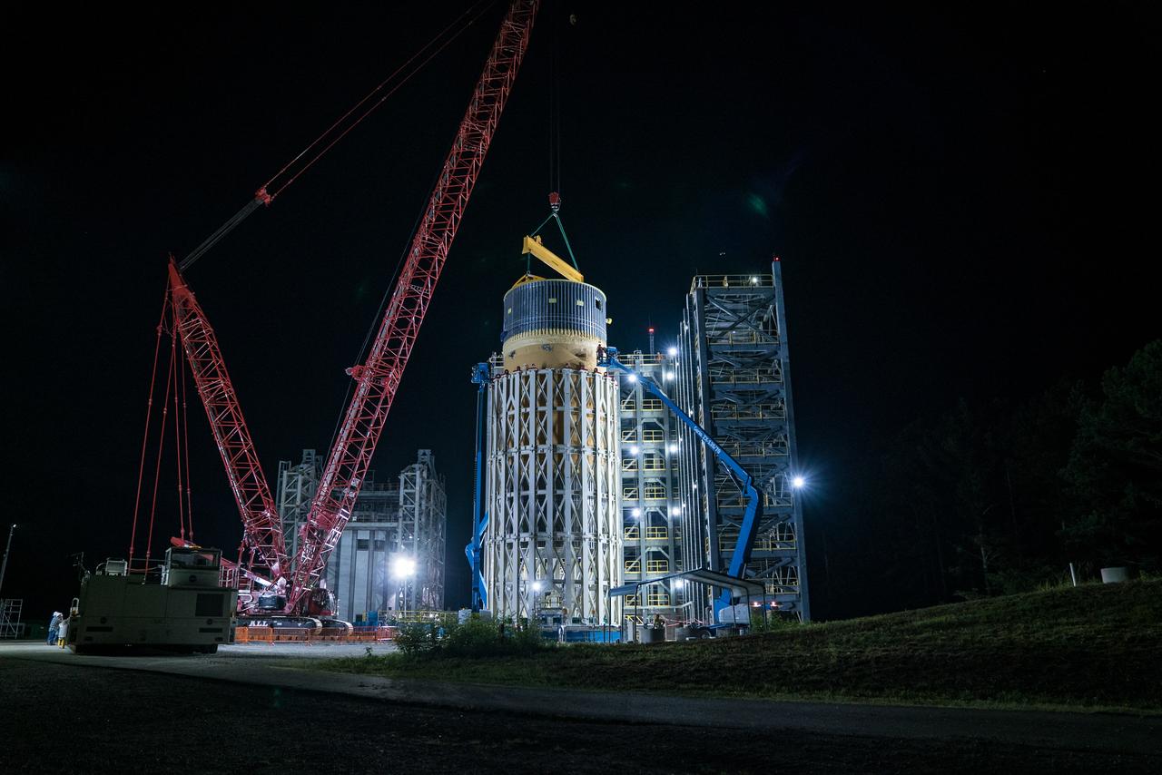 This collection of photos shows the steps NASA engineers took to lift the final structural test article for NASA’s Space Launch System (SLS) core stage into Test Stand 4697 at NASA’s Marshall Space Flight Center in Huntsville, Alabama, July 10, 2019. The liquid oxygen (LOX) tank is one of two propellant tanks in the rocket’s massive core stage that will produce more than 2 million pounds of thrust to help launch Artemis 1, the first flight of NASA’s Orion spacecraft and SLS, to the Moon. The nearly 70-foot-long liquid oxygen tank structural test article was manufactured at NASA’s Michoud Assembly Facility in New Orleans and delivered by NASA’s barge Pegasus to Marshall. Once bolted into the test stand, dozens of hydraulic cylinders will push and pull the tank, subjecting it to the same stresses and forces it will endure during liftoff and flight, to verify it is fit for flight.