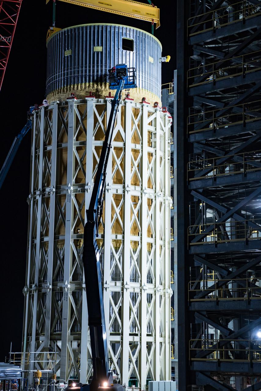 This collection of photos shows the steps NASA engineers took to lift the final structural test article for NASA’s Space Launch System (SLS) core stage into Test Stand 4697 at NASA’s Marshall Space Flight Center in Huntsville, Alabama, July 10, 2019. The liquid oxygen (LOX) tank is one of two propellant tanks in the rocket’s massive core stage that will produce more than 2 million pounds of thrust to help launch Artemis 1, the first flight of NASA’s Orion spacecraft and SLS, to the Moon. The nearly 70-foot-long liquid oxygen tank structural test article was manufactured at NASA’s Michoud Assembly Facility in New Orleans and delivered by NASA’s barge Pegasus to Marshall. Once bolted into the test stand, dozens of hydraulic cylinders will push and pull the tank, subjecting it to the same stresses and forces it will endure during liftoff and flight, to verify it is fit for flight.