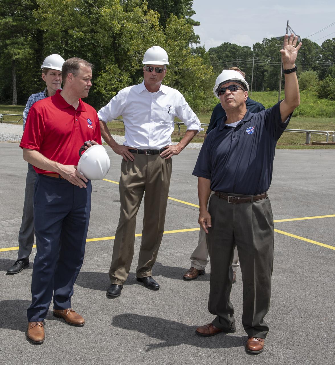 On August 15, 2018 NASA Administrator Jim Bridenstine visited Marshall Space Flight Center. Upon his arrival he was greeted by MSFC Acting Director Jody Singer along with the senior management team. From atop Marshall’s Test Stand 4693, NASA Administrator Jim Bridenstine and SLS Stages Integration Manager Tim Flores discuss the capabilities of Marshall’s newest test stand. The qualification test version of the liquid hydrogen tank for the Space Launch System’s core stage will be positioned between the stand’s 221-foot-tall twin towers where it will be pushed, pulled and subjected to the stresses it will endure during liftoff and flight.