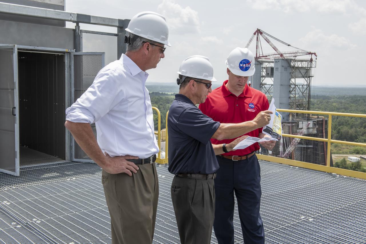 On August 15, 2018 NASA Administrator Jim Bridenstine visited Marshall Space Flight Center. Upon his arrival he was greeted by MSFC Acting Director Jody Singer along with the senior management team. From atop Marshallâ€™s Test Stand 4693, NASA Administrator Jim Bridenstine and SLS Stages Integration Manager Tim Flores discuss the capabilities of Marshallâ€™s newest test stand. The qualification test version of the liquid hydrogen tank for the Space Launch Systemâ€™s core stage will be positioned between the standâ€™s 221-foot-tall twin towers where it will be pushed, pulled and subjected to the stresses it will endure during liftoff and flight. 
