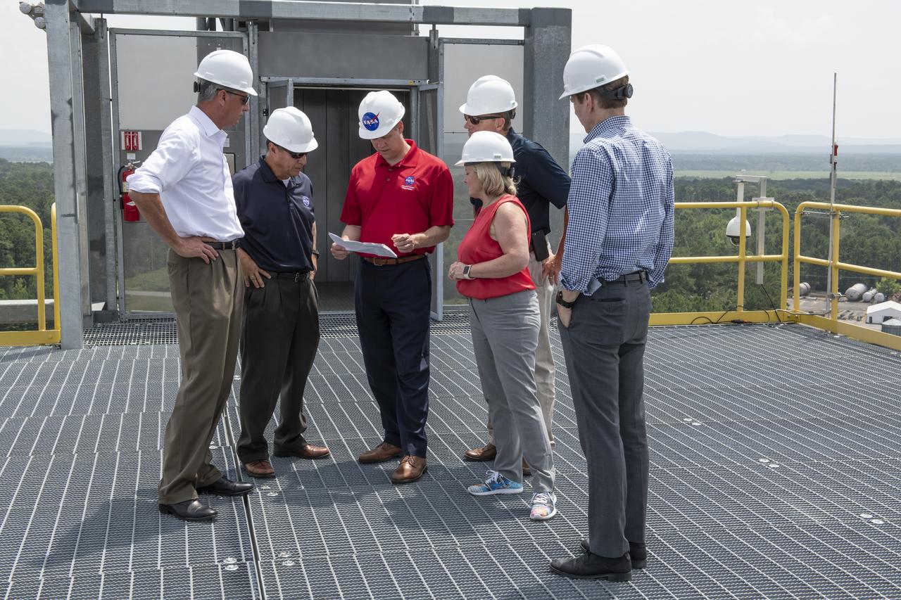 On August 15, 2018 NASA Administrator Jim Bridenstine visited Marshall Space Flight Center. Upon his arrival he was greeted by MSFC Acting Director Jody Singer along with the senior management team. From atop Marshallâ€™s Test Stand 4693, NASA Administrator Jim Bridenstine and SLS Stages Integration Manager Tim Flores discuss the capabilities of Marshallâ€™s newest test stand. The qualification test version of the liquid hydrogen tank for the Space Launch Systemâ€™s core stage will be positioned between the standâ€™s 221-foot-tall twin towers where it will be pushed, pulled and subjected to the stresses it will endure during liftoff and flight.