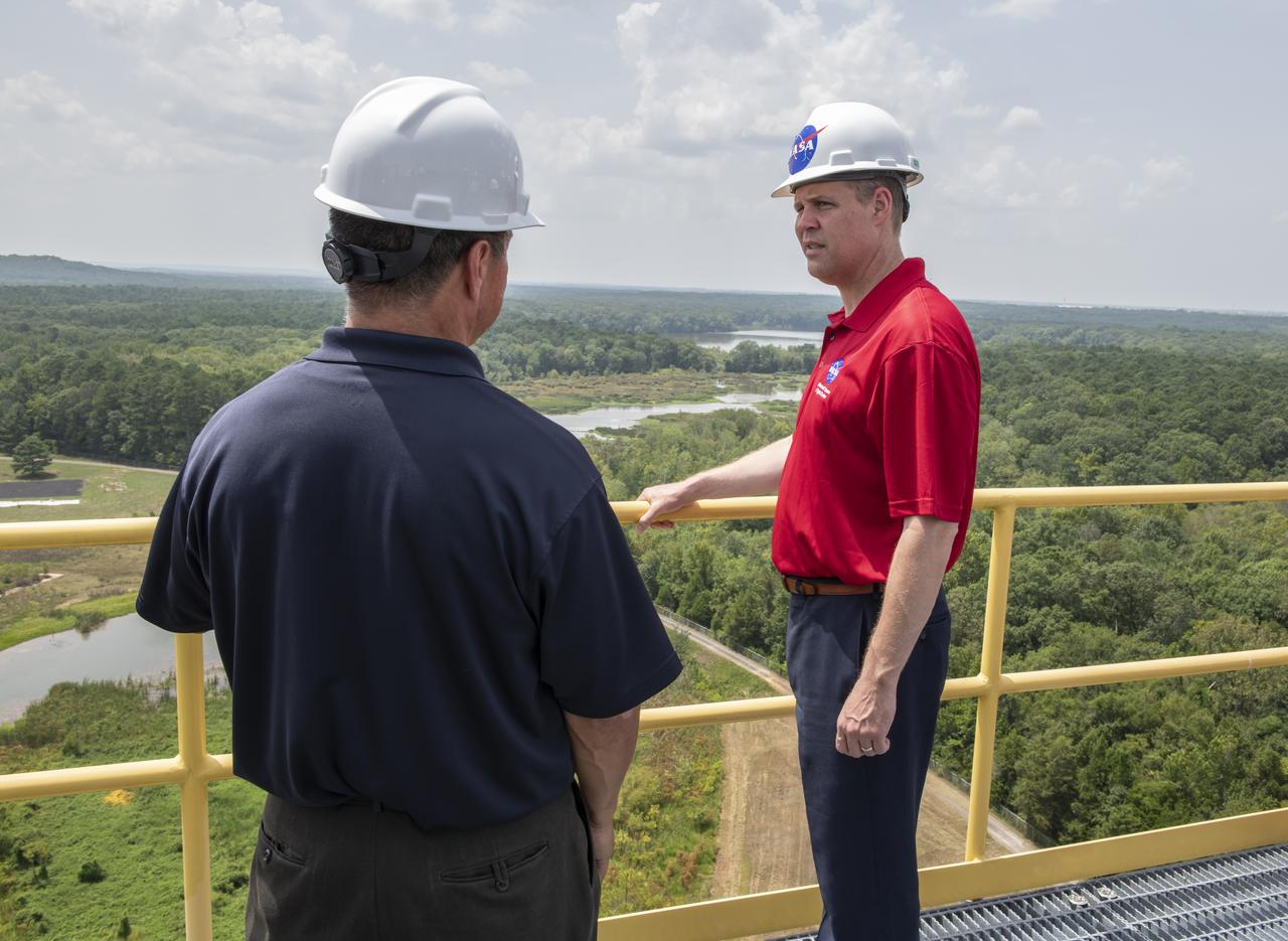 On August 15, 2018 NASA Administrator Jim Bridenstine visited Marshall Space Flight Center. Upon his arrival he was greeted by MSFC Acting Director Jody Singer along with the senior management team. From atop Marshallâ€™s Test Stand 4693, NASA Administrator Jim Bridenstine and SLS Stages Integration Manager Tim Flores discuss the capabilities of Marshallâ€™s newest test stand. The qualification test version of the liquid hydrogen tank for the Space Launch Systemâ€™s core stage will be positioned between the standâ€™s 221-foot-tall twin towers where it will be pushed, pulled and subjected to the stresses it will endure during liftoff and flight.