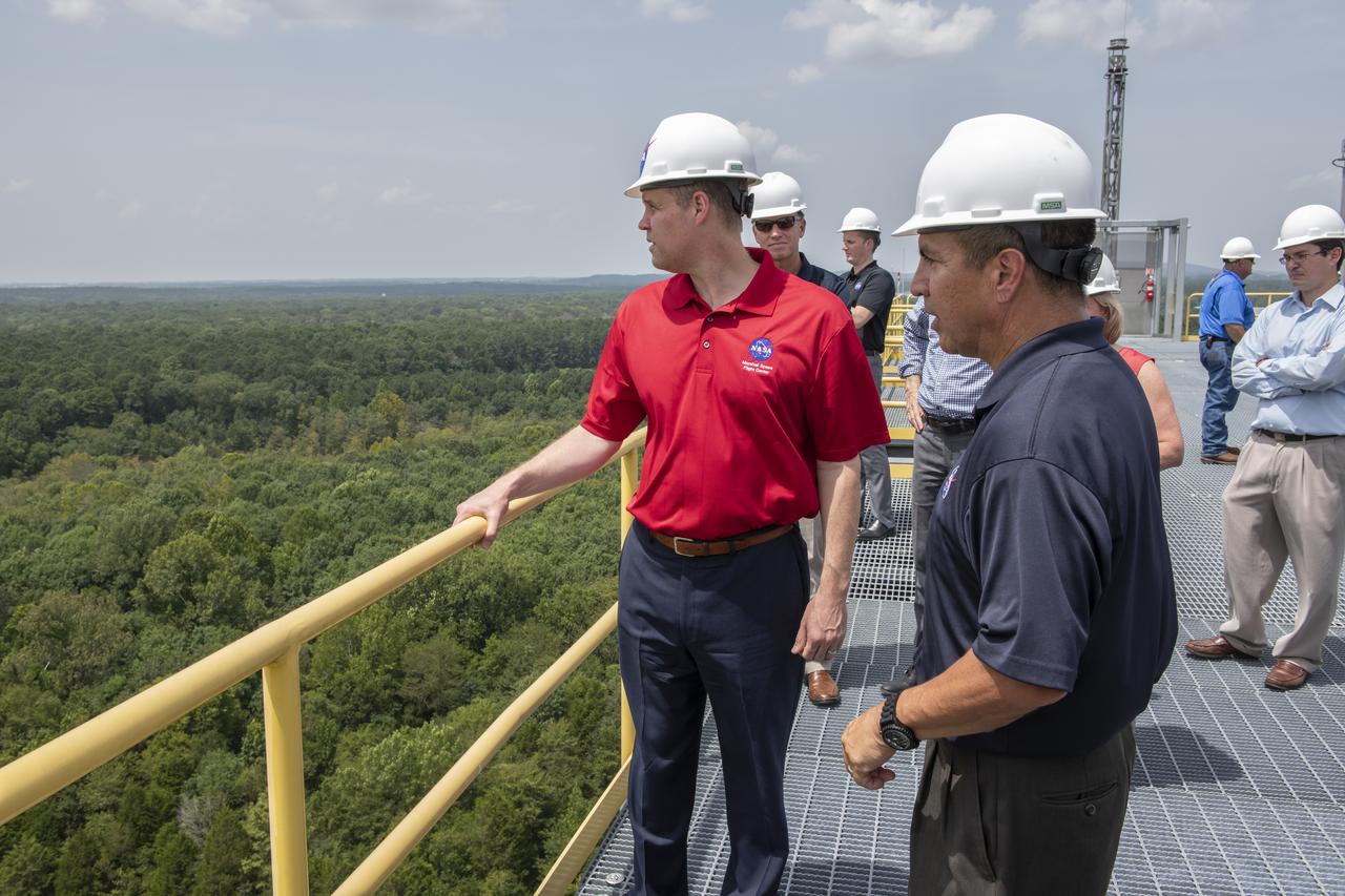 On August 15, 2018 NASA Administrator Jim Bridenstine visited Marshall Space Flight Center. Upon his arrival he was greeted by MSFC Acting Director Jody Singer along with the senior management team. From atop Marshallâ€™s Test Stand 4693, NASA Administrator Jim Bridenstine and SLS Stages Integration Manager Tim Flores discuss the capabilities of Marshallâ€™s newest test stand. The qualification test version of the liquid hydrogen tank for the Space Launch Systemâ€™s core stage will be positioned between the standâ€™s 221-foot-tall twin towers where it will be pushed, pulled and subjected to the stresses it will endure during liftoff and flight.