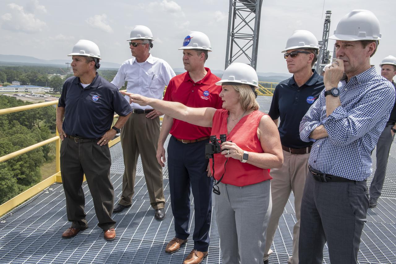 On August 15, 2018 NASA Administrator Jim Bridenstine visited Marshall Space Flight Center. Upon his arrival he was greeted by MSFC Acting Director Jody Singer along with the senior management team. From atop Marshall’s Test Stand 4693, NASA Administrator Jim Bridenstine and SLS Stages Integration Manager Tim Flores discuss the capabilities of Marshall’s newest test stand. The qualification test version of the liquid hydrogen tank for the Space Launch System’s core stage will be positioned between the stand’s 221-foot-tall twin towers where it will be pushed, pulled and subjected to the stresses it will endure during liftoff and flight.