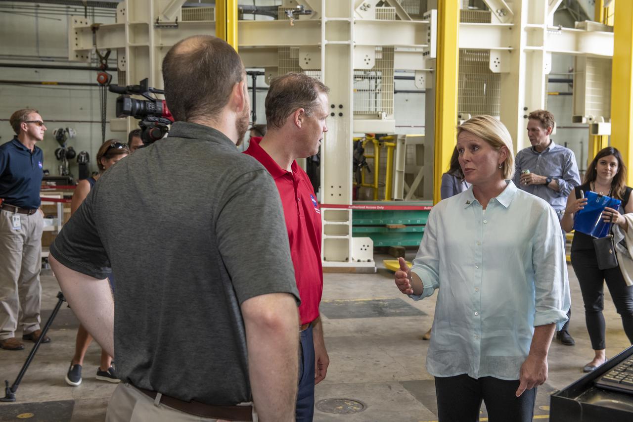 On August 15, 2018 NASA Administrator Jim Bridenstine visited Marshall Space Flight Center. Upon his arrival he was greeted by MSFC Acting Director Jody Singer along with the senior management team. Lead test engineer for the Space Launch System core stage intertank, Matt Cash briefs NASA Administrator Jim Bridenstine on testing progress of the SLS test article in the Structural Strength Lab at Marshall. The test article is structurally identical to the flight version of the intertank that will connect the core stage's two colossal fuel tanks, serve as the upper-connection point for the two solid rocket boosters and house critical avionics and electronics.