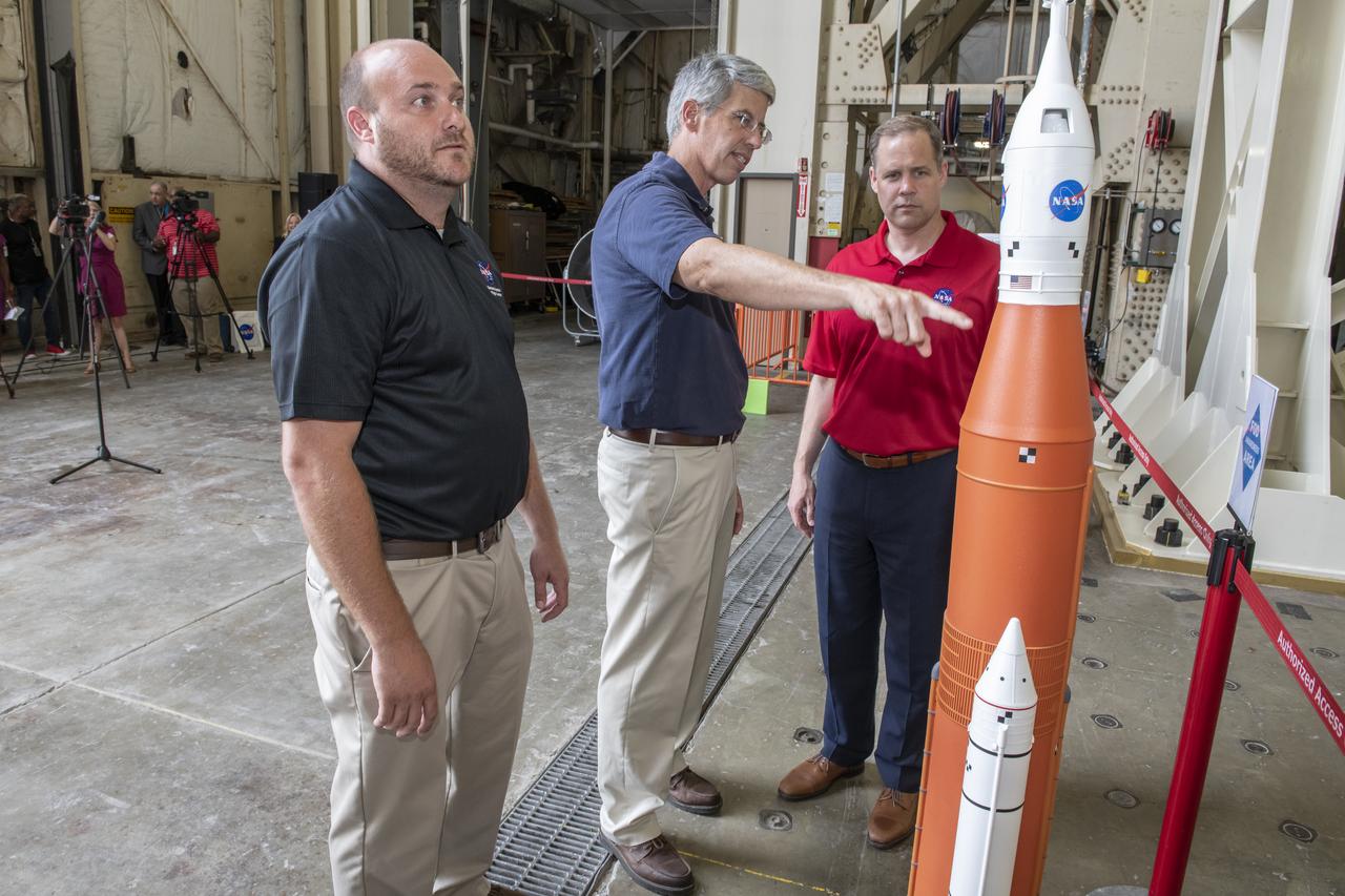 On August 15, 2018 NASA Administrator Jim Bridenstine visited Marshall Space Flight Center. Upon his arrival he was greeted by MSFC Acting Director Jody Singer along with the senior management team. Lead test engineer for the Space Launch System core stage intertank, Matt Cash briefs NASA Administrator Jim Bridenstine on testing progress of the SLS test article in the Structural Strength Lab at Marshall. The test article is structurally identical to the flight version of the intertank that will connect the core stage's two colossal fuel tanks, serve as the upper-connection point for the two solid rocket boosters and house critical avionics and electronics.