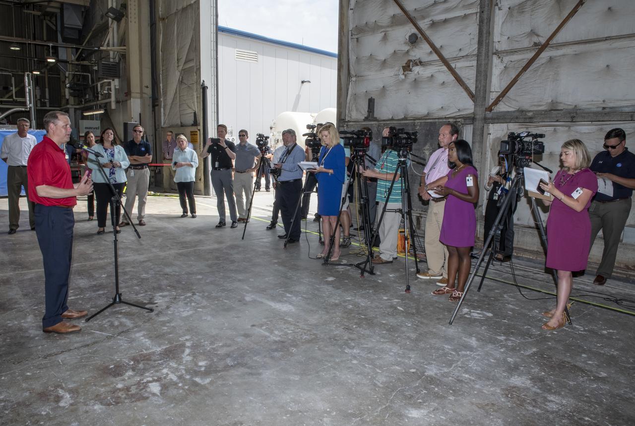 On August 15, 2018 NASA Administrator Jim Bridenstine visited Marshall Space Flight Center. Upon his arrival he was greeted by MSFC Acting Director Jody Singer along with the senior management team.  NASA Administrator Jim Bridenstine addresses the media about the progress of the Space Launch System development and testing during a question-and-answer session in front of the SLS intertank test article at Marshall. SLS, which is managed by Marshall, will enable a new era of exploration beyond Earth's orbit by launching astronauts on missions to deep space destinations including the Moon and Mars. 