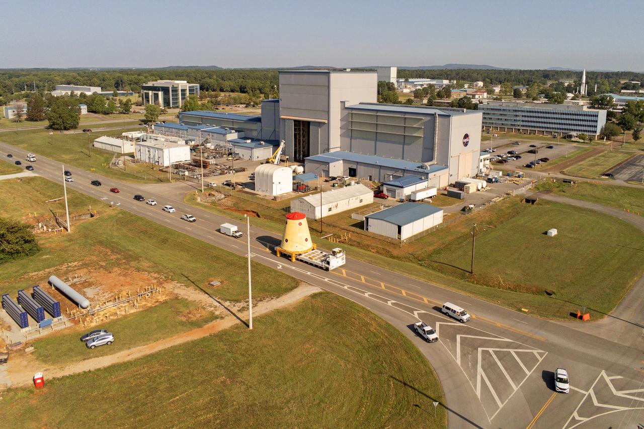 NASA rolled out a key piece of space flight hardware for the SLS (Space Launch System) rocket for the first crewed mission of NASA’s Artemis campaign from Marshall Space Flight Center in Huntsville, Alabama, on Wednesday, Aug. 21 for shipment to the agency’s spaceport in Florida. The cone-shaped launch vehicle stage adapter connects the rocket’s core stage to the upper stage and helps protect the upper stage’s engine that will help propel the Artemis II test flight around the Moon, slated for 2025. Manufactured by prime contractor Teledyne Brown Engineering and the Jacobs Space Exploration Group’s ESSCA (Engineering Services and Science Capability Augmentation) contract using NASA Marshall’s self-reacting friction-stir robotic and vertical weld tools. Crews moved the adapter out of NASA Marshall’s Building 4708 to the agency’s Pegasus barge Aug. 21. The barge will ferry the adapter first to NASA’s Michoud Assembly Facility in New Orleans, where crews will pick up additional SLS hardware for future Artemis missions, before traveling to NASA Kennedy. Once in Florida, the adapter will join the recently delivered core stage. There, teams with NASA’s Exploration Ground Systems will prepare the adapter for stacking and launch.