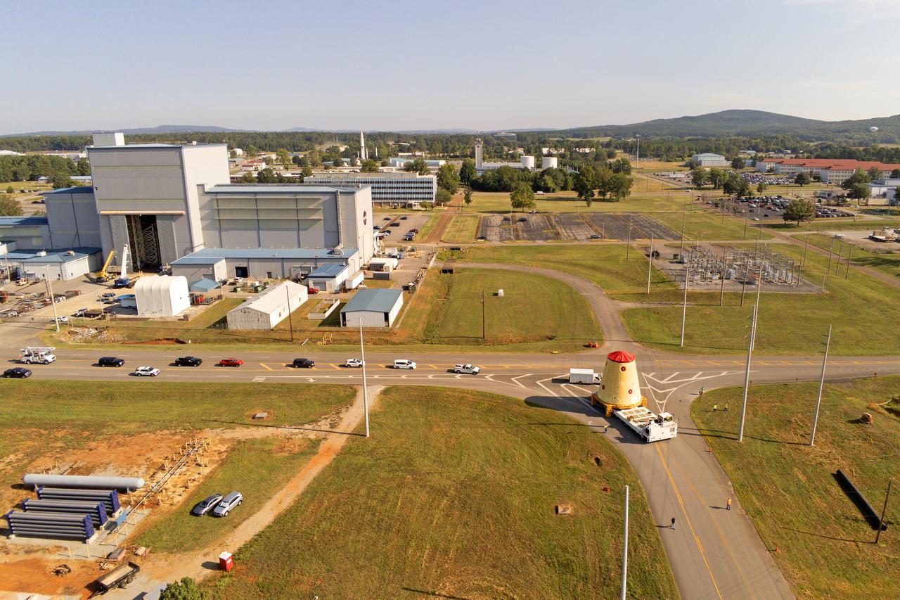 NASA rolled out a key piece of space flight hardware for the SLS (Space Launch System) rocket for the first crewed mission of NASA’s Artemis campaign from Marshall Space Flight Center in Huntsville, Alabama, on Wednesday, Aug. 21 for shipment to the agency’s spaceport in Florida. The cone-shaped launch vehicle stage adapter connects the rocket’s core stage to the upper stage and helps protect the upper stage’s engine that will help propel the Artemis II test flight around the Moon, slated for 2025. Manufactured by prime contractor Teledyne Brown Engineering and the Jacobs Space Exploration Group’s ESSCA (Engineering Services and Science Capability Augmentation) contract using NASA Marshall’s self-reacting friction-stir robotic and vertical weld tools. Crews moved the adapter out of NASA Marshall’s Building 4708 to the agency’s Pegasus barge Aug. 21. The barge will ferry the adapter first to NASA’s Michoud Assembly Facility in New Orleans, where crews will pick up additional SLS hardware for future Artemis missions, before traveling to NASA Kennedy. Once in Florida, the adapter will join the recently delivered core stage. There, teams with NASA’s Exploration Ground Systems will prepare the adapter for stacking and launch.