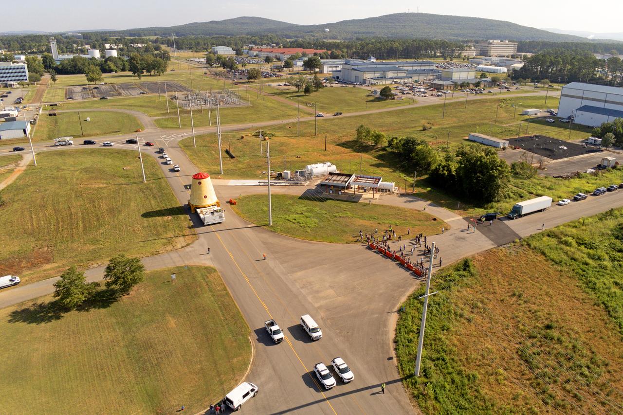 NASA rolled out a key piece of space flight hardware for the SLS (Space Launch System) rocket for the first crewed mission of NASA’s Artemis campaign from Marshall Space Flight Center in Huntsville, Alabama, on Wednesday, Aug. 21 for shipment to the agency’s spaceport in Florida. The cone-shaped launch vehicle stage adapter connects the rocket’s core stage to the upper stage and helps protect the upper stage’s engine that will help propel the Artemis II test flight around the Moon, slated for 2025. Manufactured by prime contractor Teledyne Brown Engineering and the Jacobs Space Exploration Group’s ESSCA (Engineering Services and Science Capability Augmentation) contract using NASA Marshall’s self-reacting friction-stir robotic and vertical weld tools. Crews moved the adapter out of NASA Marshall’s Building 4708 to the agency’s Pegasus barge Aug. 21. The barge will ferry the adapter first to NASA’s Michoud Assembly Facility in New Orleans, where crews will pick up additional SLS hardware for future Artemis missions, before traveling to NASA Kennedy. Once in Florida, the adapter will join the recently delivered core stage. There, teams with NASA’s Exploration Ground Systems will prepare the adapter for stacking and launch.