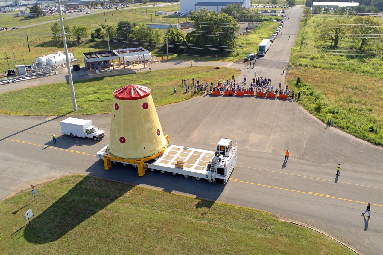NASA rolled out a key piece of space flight hardware for the SLS (Space Launch System) rocket for the first crewed mission of NASA’s Artemis campaign from Marshall Space Flight Center in Huntsville, Alabama, on Wednesday, Aug. 21 for shipment to the agency’s spaceport in Florida. The cone-shaped launch vehicle stage adapter connects the rocket’s core stage to the upper stage and helps protect the upper stage’s engine that will help propel the Artemis II test flight around the Moon, slated for 2025. Manufactured by prime contractor Teledyne Brown Engineering and the Jacobs Space Exploration Group’s ESSCA (Engineering Services and Science Capability Augmentation) contract using NASA Marshall’s self-reacting friction-stir robotic and vertical weld tools. Crews moved the adapter out of NASA Marshall’s Building 4708 to the agency’s Pegasus barge Aug. 21. The barge will ferry the adapter first to NASA’s Michoud Assembly Facility in New Orleans, where crews will pick up additional SLS hardware for future Artemis missions, before traveling to NASA Kennedy. Once in Florida, the adapter will join the recently delivered core stage. There, teams with NASA’s Exploration Ground Systems will prepare the adapter for stacking and launch.