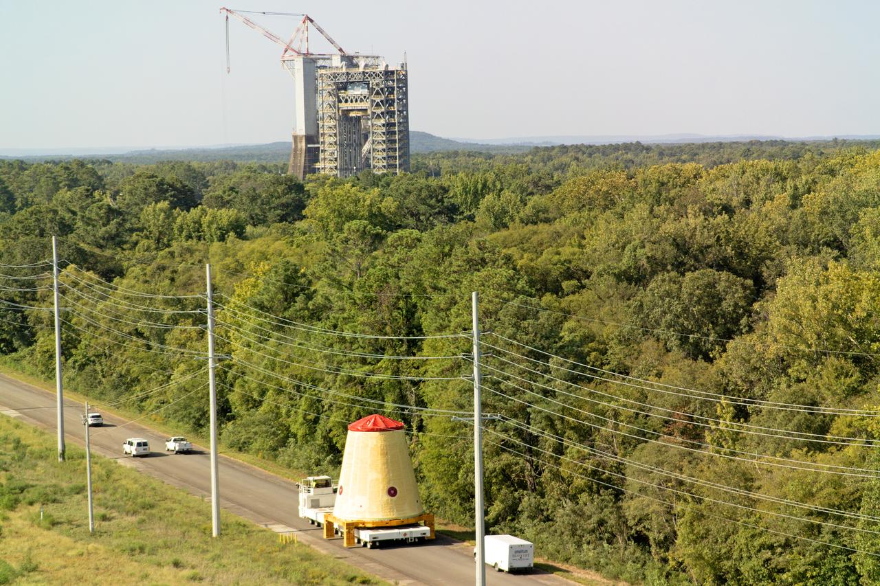 NASA rolled out a key piece of space flight hardware for the SLS (Space Launch System) rocket for the first crewed mission of NASA’s Artemis campaign from Marshall Space Flight Center in Huntsville, Alabama, on Wednesday, Aug. 21 for shipment to the agency’s spaceport in Florida. The cone-shaped launch vehicle stage adapter connects the rocket’s core stage to the upper stage and helps protect the upper stage’s engine that will help propel the Artemis II test flight around the Moon, slated for 2025. Manufactured by prime contractor Teledyne Brown Engineering and the Jacobs Space Exploration Group’s ESSCA (Engineering Services and Science Capability Augmentation) contract using NASA Marshall’s self-reacting friction-stir robotic and vertical weld tools. Crews moved the adapter out of NASA Marshall’s Building 4708 to the agency’s Pegasus barge Aug. 21. The barge will ferry the adapter first to NASA’s Michoud Assembly Facility in New Orleans, where crews will pick up additional SLS hardware for future Artemis missions, before traveling to NASA Kennedy. Once in Florida, the adapter will join the recently delivered core stage. There, teams with NASA’s Exploration Ground Systems will prepare the adapter for stacking and launch.