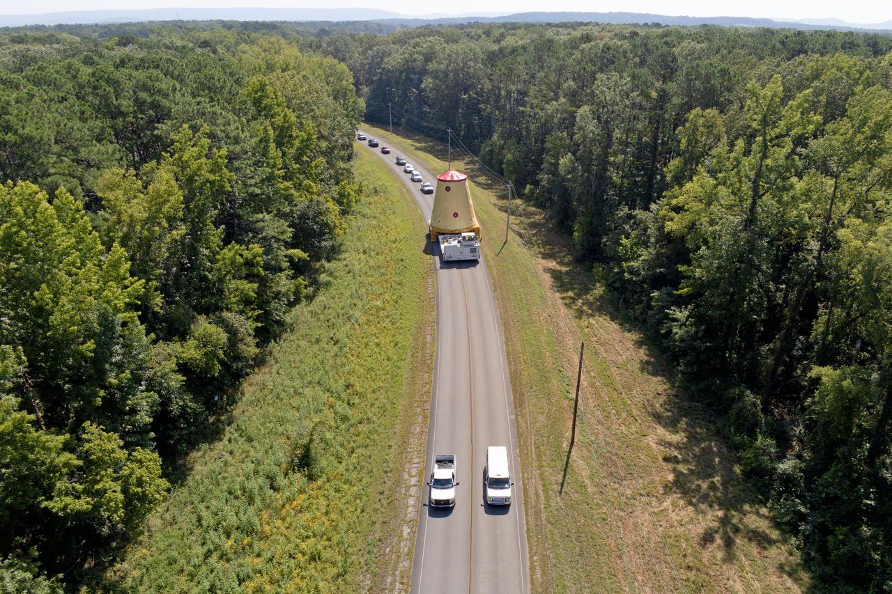 NASA rolled out a key piece of space flight hardware for the SLS (Space Launch System) rocket for the first crewed mission of NASA’s Artemis campaign from Marshall Space Flight Center in Huntsville, Alabama, on Wednesday, Aug. 21 for shipment to the agency’s spaceport in Florida. The cone-shaped launch vehicle stage adapter connects the rocket’s core stage to the upper stage and helps protect the upper stage’s engine that will help propel the Artemis II test flight around the Moon, slated for 2025. Manufactured by prime contractor Teledyne Brown Engineering and the Jacobs Space Exploration Group’s ESSCA (Engineering Services and Science Capability Augmentation) contract using NASA Marshall’s self-reacting friction-stir robotic and vertical weld tools. Crews moved the adapter out of NASA Marshall’s Building 4708 to the agency’s Pegasus barge Aug. 21. The barge will ferry the adapter first to NASA’s Michoud Assembly Facility in New Orleans, where crews will pick up additional SLS hardware for future Artemis missions, before traveling to NASA Kennedy. Once in Florida, the adapter will join the recently delivered core stage. There, teams with NASA’s Exploration Ground Systems will prepare the adapter for stacking and launch.