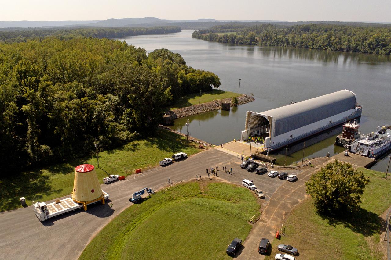 NASA rolled out a key piece of space flight hardware for the SLS (Space Launch System) rocket for the first crewed mission of NASA’s Artemis campaign from Marshall Space Flight Center in Huntsville, Alabama, on Wednesday, Aug. 21 for shipment to the agency’s spaceport in Florida. The cone-shaped launch vehicle stage adapter connects the rocket’s core stage to the upper stage and helps protect the upper stage’s engine that will help propel the Artemis II test flight around the Moon, slated for 2025. Manufactured by prime contractor Teledyne Brown Engineering and the Jacobs Space Exploration Group’s ESSCA (Engineering Services and Science Capability Augmentation) contract using NASA Marshall’s self-reacting friction-stir robotic and vertical weld tools. Crews moved the adapter out of NASA Marshall’s Building 4708 to the agency’s Pegasus barge Aug. 21. The barge will ferry the adapter first to NASA’s Michoud Assembly Facility in New Orleans, where crews will pick up additional SLS hardware for future Artemis missions, before traveling to NASA Kennedy. Once in Florida, the adapter will join the recently delivered core stage. There, teams with NASA’s Exploration Ground Systems will prepare the adapter for stacking and launch.