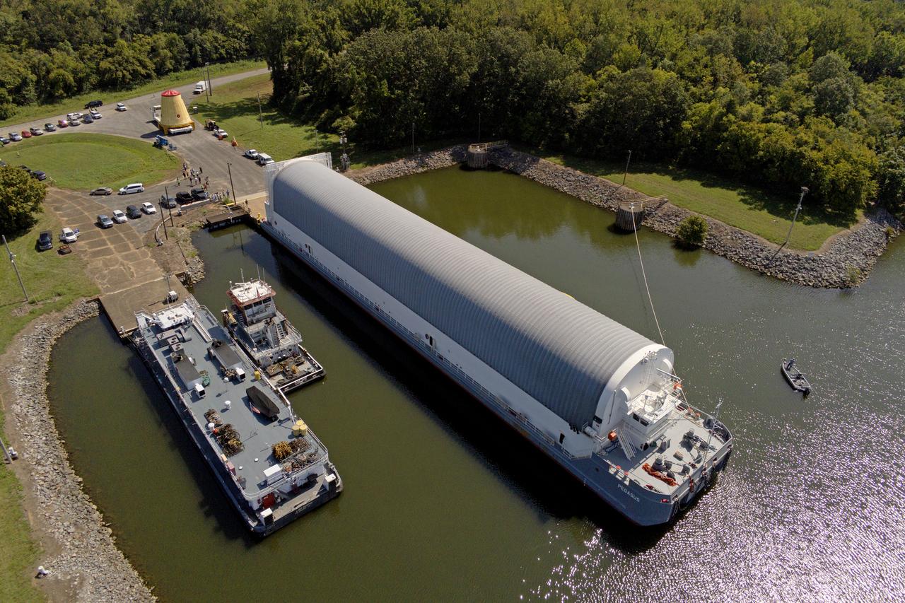 NASA rolled out a key piece of space flight hardware for the SLS (Space Launch System) rocket for the first crewed mission of NASA’s Artemis campaign from Marshall Space Flight Center in Huntsville, Alabama, on Wednesday, Aug. 21 for shipment to the agency’s spaceport in Florida. The cone-shaped launch vehicle stage adapter connects the rocket’s core stage to the upper stage and helps protect the upper stage’s engine that will help propel the Artemis II test flight around the Moon, slated for 2025. Manufactured by prime contractor Teledyne Brown Engineering and the Jacobs Space Exploration Group’s ESSCA (Engineering Services and Science Capability Augmentation) contract using NASA Marshall’s self-reacting friction-stir robotic and vertical weld tools. Crews moved the adapter out of NASA Marshall’s Building 4708 to the agency’s Pegasus barge Aug. 21. The barge will ferry the adapter first to NASA’s Michoud Assembly Facility in New Orleans, where crews will pick up additional SLS hardware for future Artemis missions, before traveling to NASA Kennedy. Once in Florida, the adapter will join the recently delivered core stage. There, teams with NASA’s Exploration Ground Systems will prepare the adapter for stacking and launch.