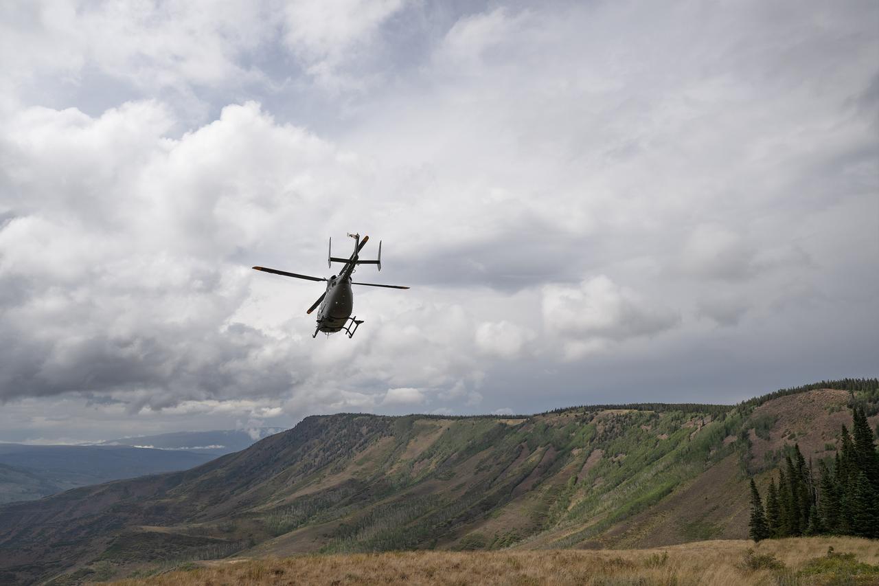 These photos and videos show how NASA certified a new lander flight training course using helicopters in the mountains of northern Colorado. NASA is partnering with the Colorado Army National Guard at its High-Altitude Army National Guard Aviation Training Site near Gypsum, Colorado, to develop the foundational flight training course that will help astronauts practice flight and landing procedures for the Moon. The certification marks an important milestone in crew training for Artemis missions to the Moon, when astronauts will use a commercial human landing system to land on the lunar surface. During the two-week certification run in late August 2025, NASA astronauts Matthew Dominick and Mark Vande Hei participated in flight and landing training to help certify the course. The pair, along with trained instructor pilots with the Army National Guard, took turns flying a helicopter and navigating to landing zones. Artemis flight crew trainers, mission control leads, and lunar lander operational experts from NASA Johnson joined them on each helicopter flight to assess the instruction, training environment, and technical applications for crewed lunar missions. For more information, contact NASA Marshall’s Office of Communications at 256-544