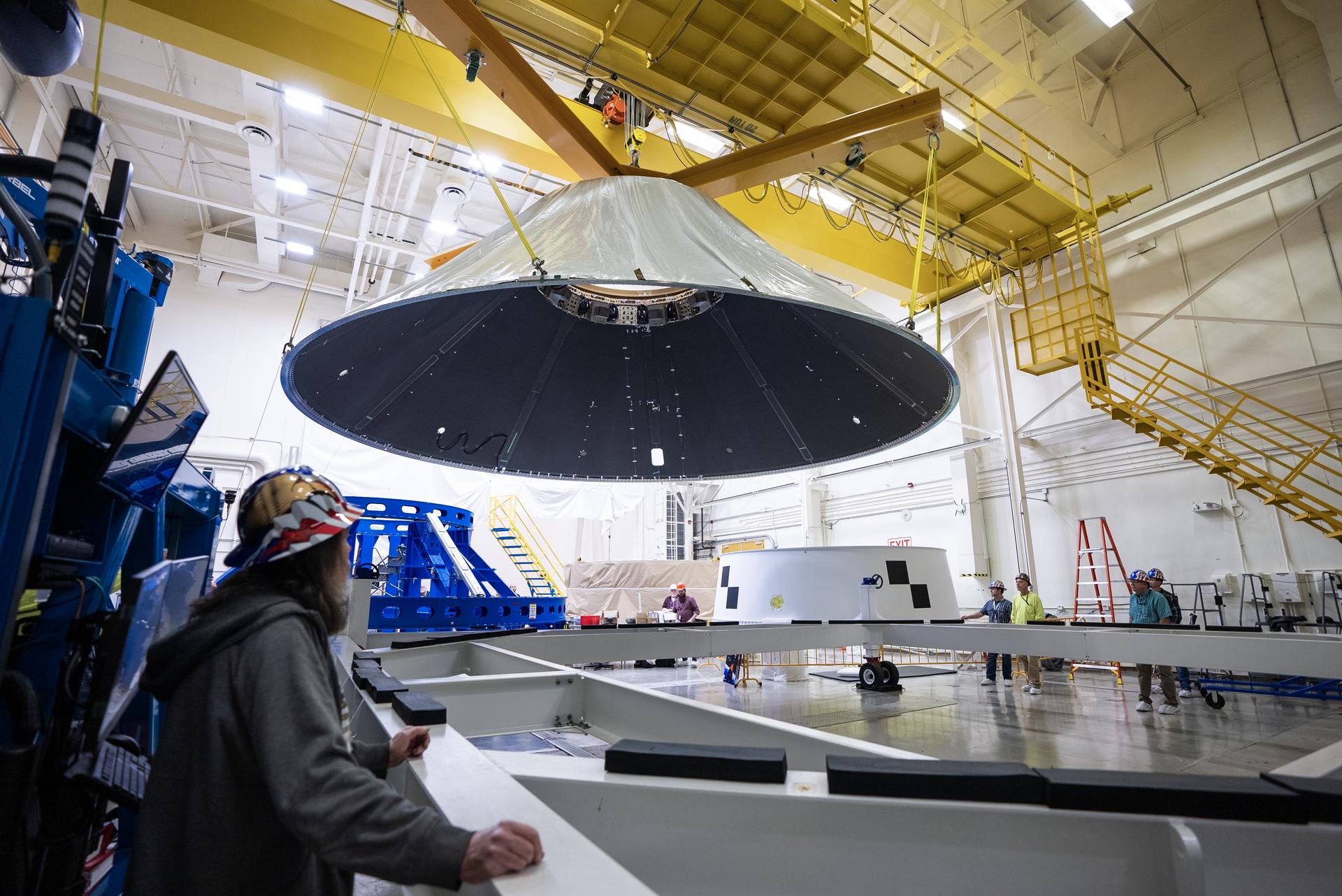 These photos and videos show how NASA manufactured and prepared to transport the payload adapter in February inside Building 4708 at NASA’s Marshall Space Flight Center in Huntsville, Alabama. Prior to moving the hardware for testing, teams installed the New Explorations Secondary Transport component, called the NEST, into the top of the engineering development unit. The NEST component will allow the hardware to hold a series of secondary payloads, or small satellites. The cone-shaped payload adapter is about 8.5 feet tall and features two metal rings and eight composite panels. The adapter, which will debut on NASA’s Artemis IV mission, is an evolution from the Orion stage adapter used in the Block 1 configuration of the rocket for the first three Artemis missions. It will be housed inside the universal stage adapter atop the rocket’s more powerful in-space stage, called the exploration upper stage. The payload adapter, like the launch vehicle stage adapter and the Orion stage adapter, is fully manufactured and tested at Marshall, which manages the SLS Program. NASA is working to land the first woman, first person of color, and its first international partner astronaut on the Moon under Artemis. SLS is part of NASA’s backbone for deep space exploration, along with the Orion spacecraft and Gateway in orbit around the Moon and commercial human landing systems, next-generational spacesuits, and rovers on the lunar surface. SLS is the only rocket that can send Orion, astronauts, and supplies to the Moon in a single launch.