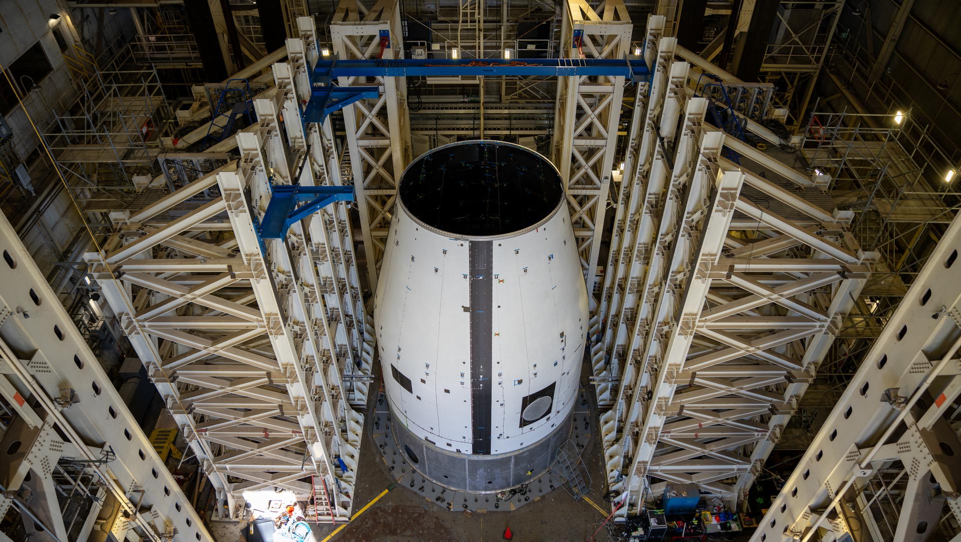 These photos and videos show how crews guided a test version of the universal stage adapter for NASA’s more powerful version of its SLS (Space Launch System) rocket to Building 4619 at the agency’s Marshall Space Flight Center in Huntsville, Alabama, Feb. 22. Built by Leidos, the lead contractor for the universal stage adapter, crews transported the hardware from a Leidos facility in Decatur, Alabama, the same day. The universal stage adapter will connect the SLS rocket’s upgraded in-space propulsion stage, called the exploration upper stage, to NASA’s Orion spacecraft as part of the evolved Block 1B configuration of the SLS rocket. It will also serve as a compartment capable of accommodating large payloads, such as modules or other exploration spacecraft. In Building 4619’s Load Test Annex High Bay at Marshall, the development test article will first undergo modal testing that will shake the hardware to validate dynamic models. Later, during ultimate load testing, force will be applied vertically and to the sides of the hardware. Unlike the flight hardware, the development test article has flaws intentionally included in its design, which will help engineers verity that the flight adapter can withstand the extreme forces it will face during launch and flight.