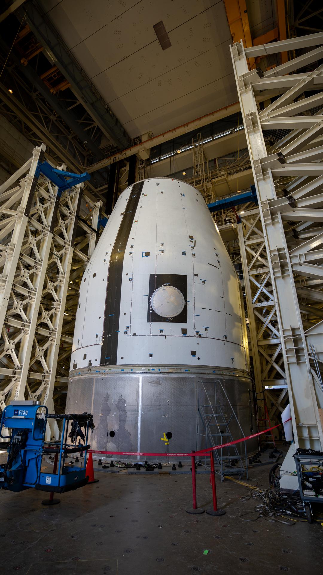 These photos and videos show how crews guided a test version of the universal stage adapter for NASA’s more powerful version of its SLS (Space Launch System) rocket to Building 4619 at the agency’s Marshall Space Flight Center in Huntsville, Alabama, Feb. 22. Built by Leidos, the lead contractor for the universal stage adapter, crews transported the hardware from a Leidos facility in Decatur, Alabama, the same day. The universal stage adapter will connect the SLS rocket’s upgraded in-space propulsion stage, called the exploration upper stage, to NASA’s Orion spacecraft as part of the evolved Block 1B configuration of the SLS rocket. It will also serve as a compartment capable of accommodating large payloads, such as modules or other exploration spacecraft.  In Building 4619’s Load Test Annex High Bay at Marshall, the development test article will first undergo modal testing that will shake the hardware to validate dynamic models. Later, during ultimate load testing, force will be applied vertically and to the sides of the hardware. Unlike the flight hardware, the development test article has flaws intentionally included in its design, which will help engineers verity that the flight adapter can withstand the extreme forces it will face during launch and flight.