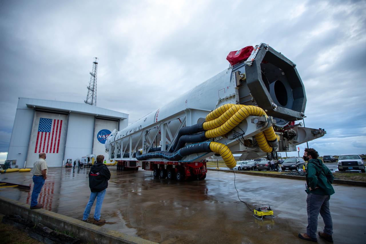 A Northrop Grumman Antares rocket carrying a Cygnus resupply spacecraft is seen as it is rolled out of the Horizontal Integration Facility to the Mid-Atlantic Regional Spaceport’s Pad-0A, Saturday, September 26, 2020, at NASA's Wallops Flight Facility in Virginia. Northrop Grumman’s 14th contracted cargo resupply mission with NASA to the International Space Station will deliver about 8,000 pounds of science and research, crew supplies and vehicle hardware to the orbital laboratory and its crew. The CRS-14 Cygnus spacecraft is named after the first female astronaut of Indian descent, Kaplana Chawla, and is scheduled to launch at 10:27 p.m., Tuesday, September 29, 2020 EDT. Photo Credit: (NASA/Patrick Black) 