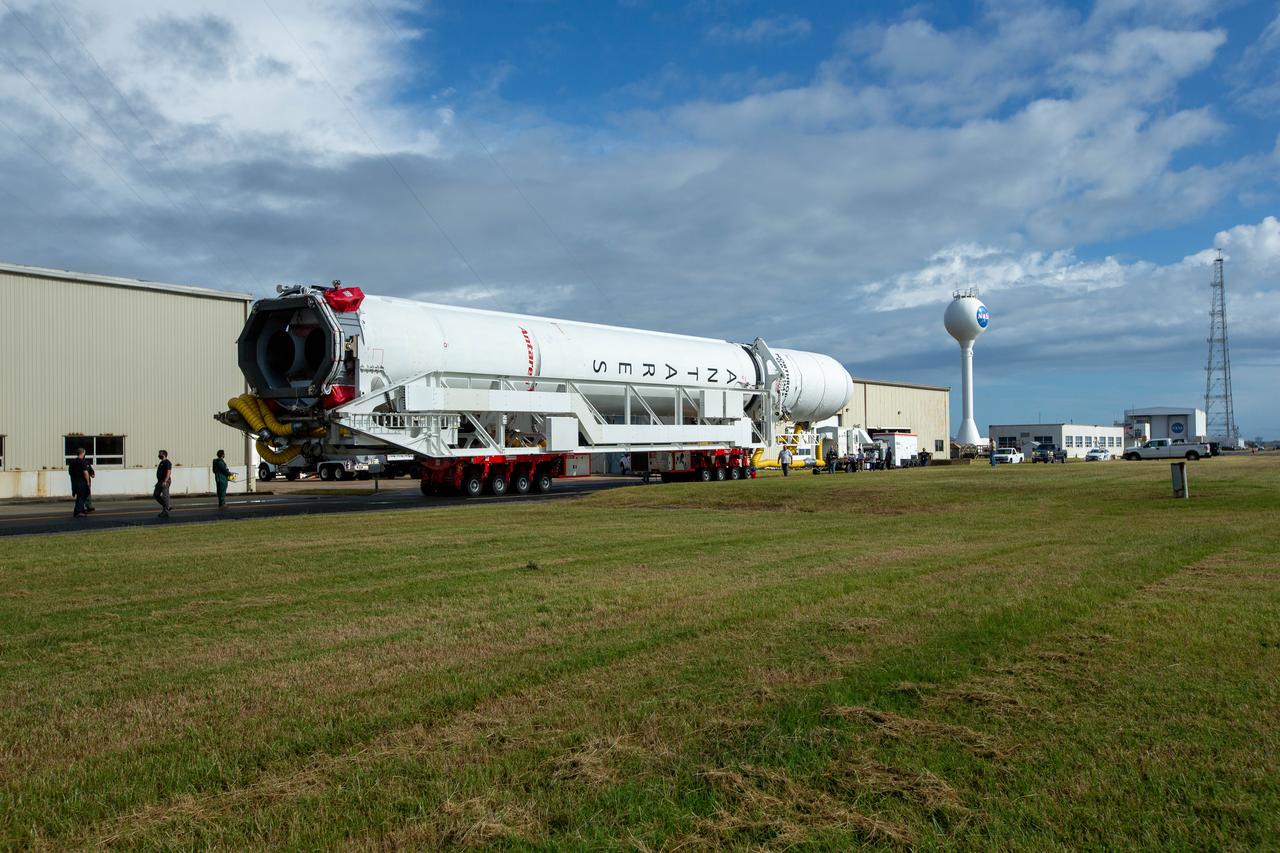 A Northrop Grumman Antares rocket carrying a Cygnus resupply spacecraft is seen as it is rolled out of the Horizontal Integration Facility to the Mid-Atlantic Regional Spaceport’s Pad-0A, Saturday, September 26, 2020, at NASA's Wallops Flight Facility in Virginia. Northrop Grumman’s 14th contracted cargo resupply mission with NASA to the International Space Station will deliver about 8,000 pounds of science and research, crew supplies and vehicle hardware to the orbital laboratory and its crew. The CRS-14 Cygnus spacecraft is named after the first female astronaut of Indian descent, Kaplana Chawla, and is scheduled to launch at 10:27 p.m., Tuesday, September 29, 2020 EDT. Photo Credit: (NASA/Patrick Black) 