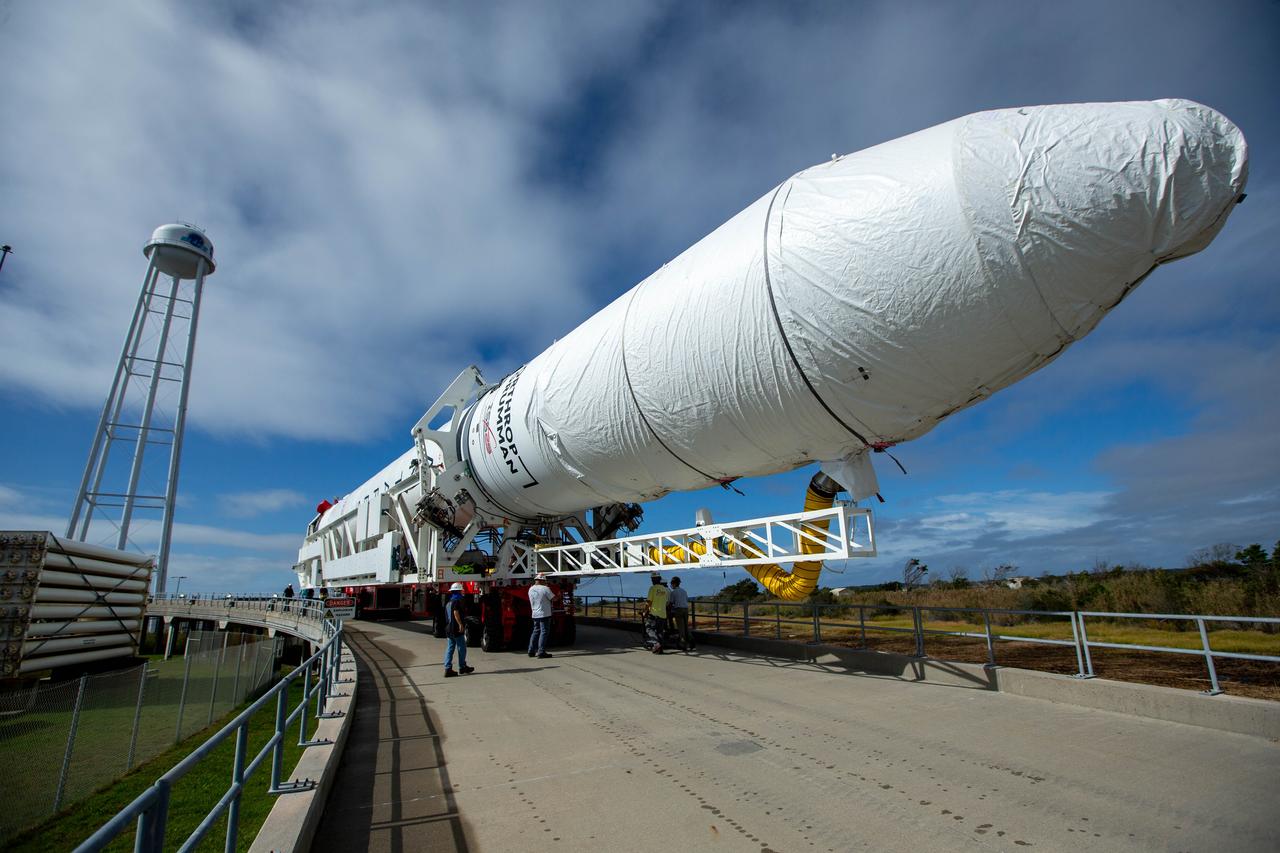 A Northrop Grumman Antares rocket carrying a Cygnus resupply spacecraft is seen as it is rolled out of the Horizontal Integration Facility to the Mid-Atlantic Regional Spaceport’s Pad-0A, Saturday, September 26, 2020, at NASA's Wallops Flight Facility in Virginia. Northrop Grumman’s 14th contracted cargo resupply mission with NASA to the International Space Station will deliver about 8,000 pounds of science and research, crew supplies and vehicle hardware to the orbital laboratory and its crew. The CRS-14 Cygnus spacecraft is named after the first female astronaut of Indian descent, Kalpana Chawla, and is scheduled to launch at 10:27 p.m., Tuesday, September 29, 2020 EDT. Photo Credit: (NASA/Patrick Black)