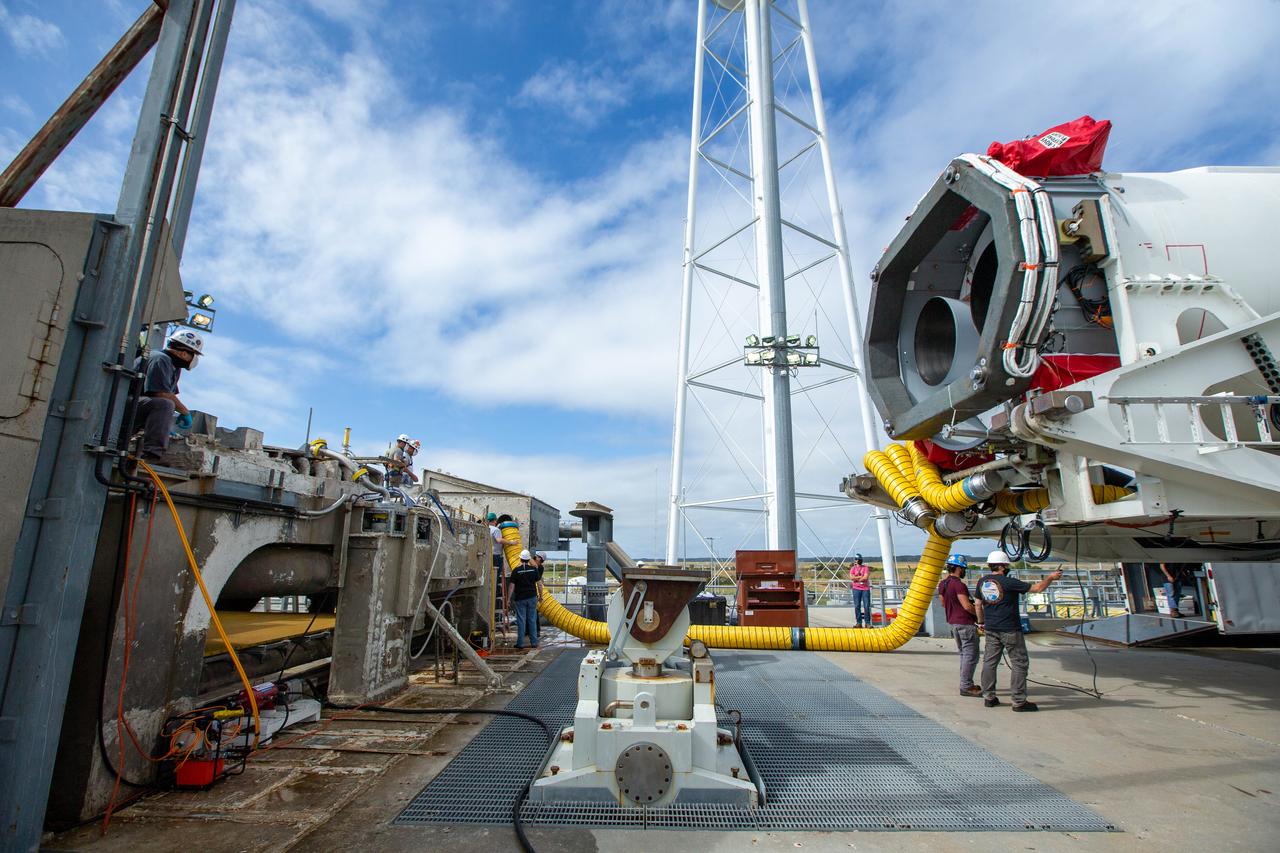 A Northrop Grumman Antares rocket carrying a Cygnus resupply spacecraft is seen as it is rolled out of the Horizontal Integration Facility to the Mid-Atlantic Regional Spaceport’s Pad-0A, Saturday, September 26, 2020, at NASA's Wallops Flight Facility in Virginia. Northrop Grumman’s 14th contracted cargo resupply mission with NASA to the International Space Station will deliver about 8,000 pounds of science and research, crew supplies and vehicle hardware to the orbital laboratory and its crew. The CRS-14 Cygnus spacecraft is named after the first female astronaut of Indian descent, Kaplana Chawla, and is scheduled to launch at 10:27 p.m., Tuesday, September 29, 2020 EDT. Photo Credit: (NASA/Patrick Black) 