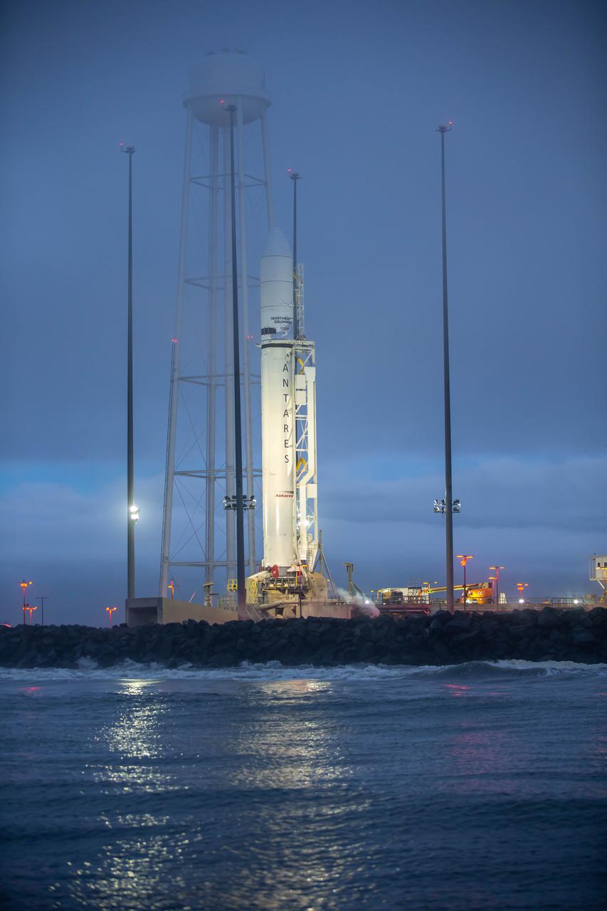 A Northrop Grumman Antares rocket carrying a Cygnus resupply spacecraft is raised into the vertical position on the Mid-Atlantic Regional Spaceport’s Pad-0A, Saturday, September 26, 2020, at NASA's Wallops Flight Facility in Virginia. Northrop Grumman’s 14th contracted cargo resupply mission with NASA to the International Space Station will deliver about 8,000 pounds of science and research, crew supplies and vehicle hardware to the orbital laboratory and its crew. The CRS-14 Cygnus spacecraft is named after the first female astronaut of Indian descent, Kalpana Chawla, and is scheduled to launch at 10:27 p.m., Tuesday, September 29, 2020 EDT. Photo Credit: (NASA/Patrick Black)