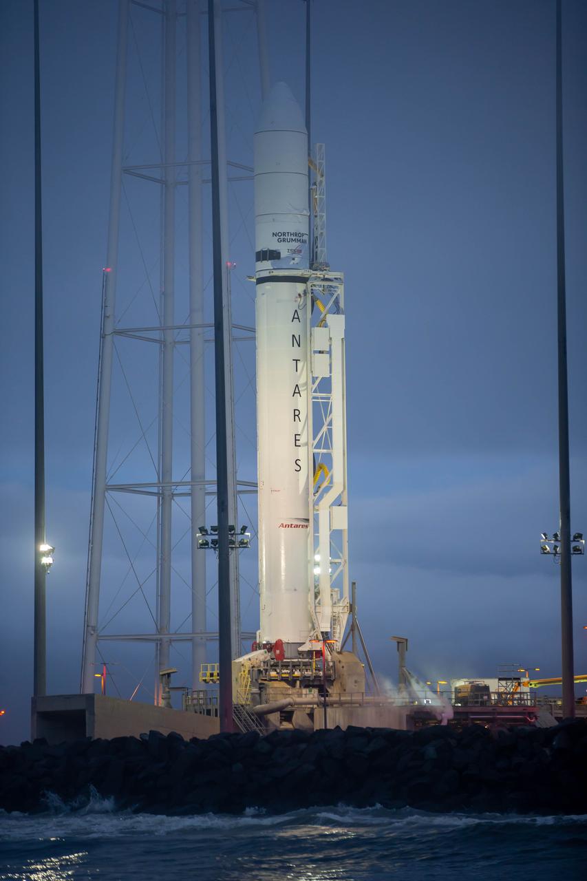 A Northrop Grumman Antares rocket carrying a Cygnus resupply spacecraft is raised into the vertical position on the Mid-Atlantic Regional Spaceport’s Pad-0A, Saturday, September 26, 2020, at NASA's Wallops Flight Facility in Virginia. Northrop Grumman’s 14th contracted cargo resupply mission with NASA to the International Space Station will deliver about 8,000 pounds of science and research, crew supplies and vehicle hardware to the orbital laboratory and its crew. The CRS-14 Cygnus spacecraft is named after the first female astronaut of Indian descent, Kalpana Chawla, and is scheduled to launch at 10:27 p.m., Tuesday, September 29, 2020 EDT. Photo Credit: (NASA/Patrick Black)