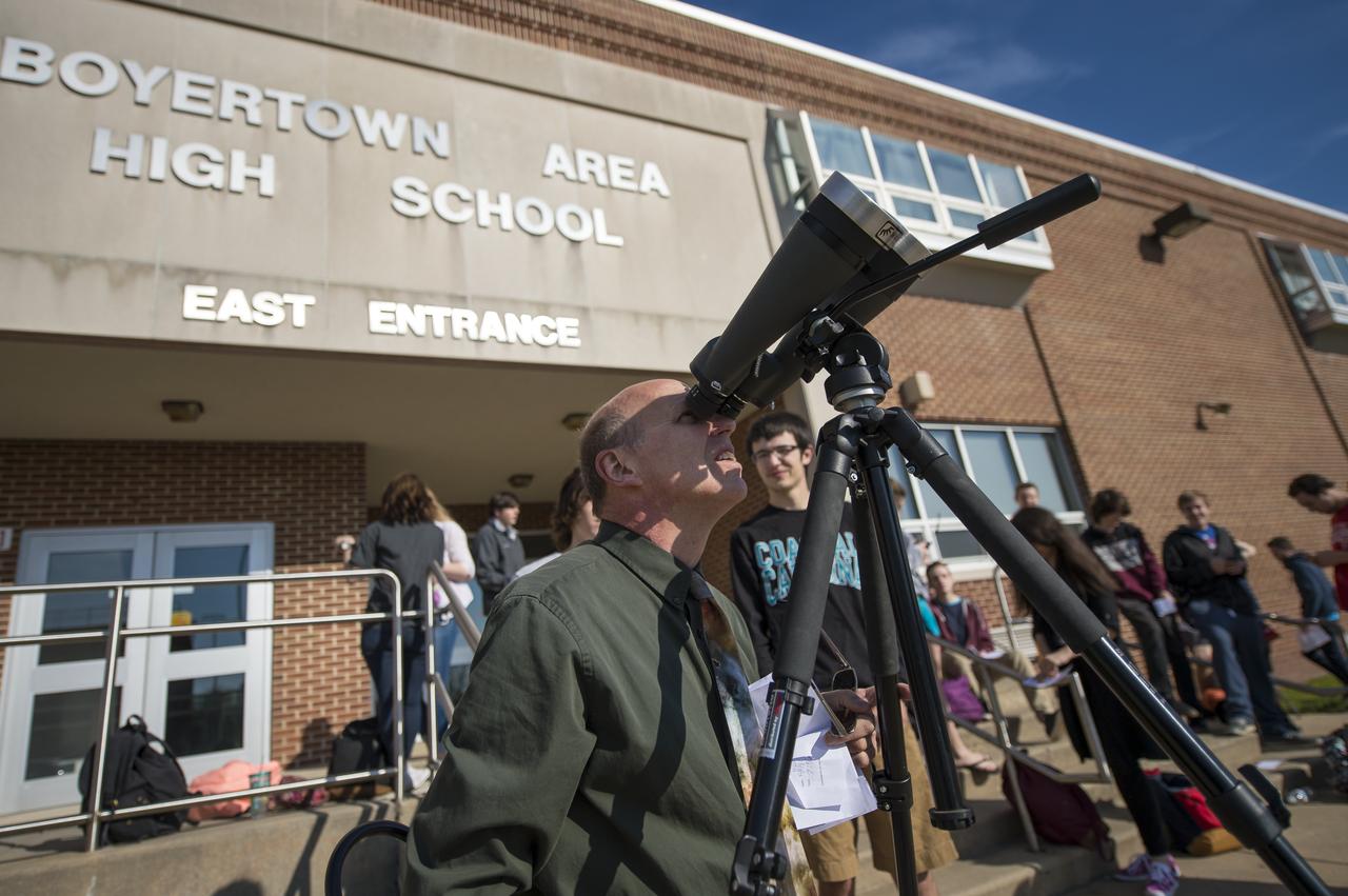 Boyertown Area High School astronomy teacher Peter Detterline prepares high powered binoculars with a solar filter so that his students may view the planet Mercury as it transits across the face of the sun , Monday, May 9, 2016, Boyertown Area High School, Boyertown, Pennsylvania.  Mercury passes between Earth and the sun only about 13 times a century, with the previous transit taking place in 2006.  Photo Credit: (NASA/Bill Ingalls)