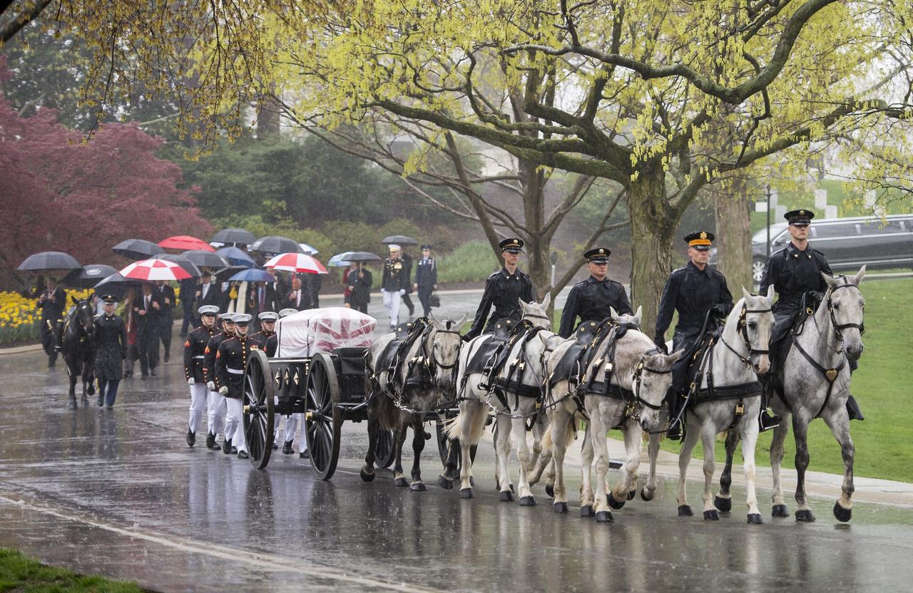 A horse drawn caisson carries former astronaut and U.S. Senator John Glenn to his final resting place during the interment ceremony at Arlington National Cemetery on Thursday, April 6, 2017 in Virginia. Glenn was the first American to orbit Earth on Feb. 20, 1962, in a five-hour flight aboard the Friendship 7 spacecraft. In 1998, he broke another record by returning to space at the age of 77 on the Space Shuttle Discovery. Photo Credit: (NASA/Aubrey Gemignani)