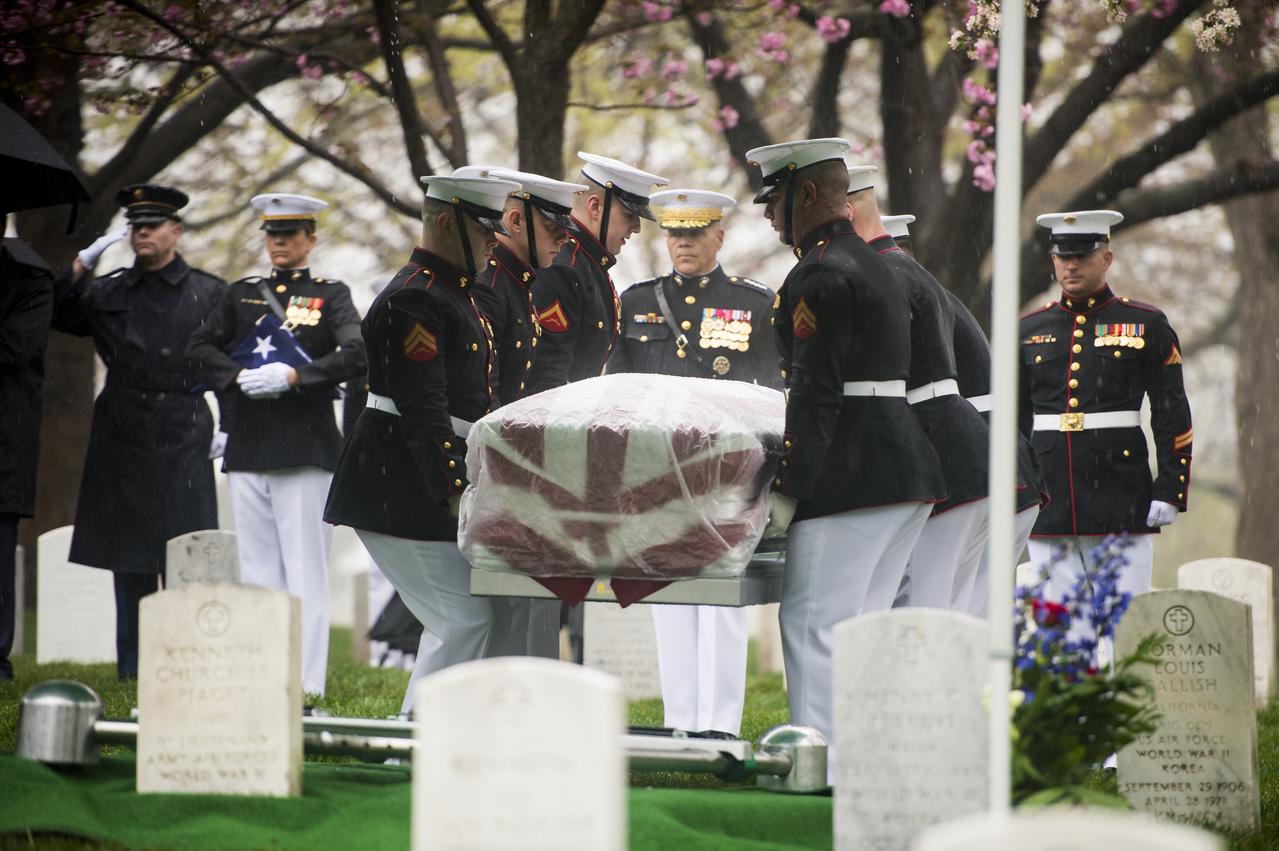 Marine Corps pallbearers lower the casket of former astronaut and U.S. Senator John Glenn at his interment at Arlington National Cemetery in Virginia on Thursday, April 6, 2017, the day on which he and his wife Annie were married in 1943. Glenn was the first American to orbit Earth on Feb. 20, 1962, in a five-hour flight aboard the Friendship 7 spacecraft. In 1998, he broke another record by returning to space at the age of 77 on the Space Shuttle Discovery. Photo Credit: (NASA/Aubrey Gemignani)