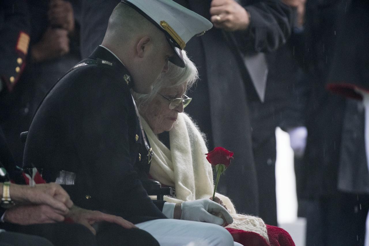 Annie Glenn, wife of former astronaut and U.S. Senator John Glenn is seen as her husband is laid to rest during a full military honors interment ceremony at Arlington National Cemetery on Thursday, April 6, 2017 in Virginia. He was the first American to orbit Earth on Feb. 20, 1962, in a five-hour flight aboard the Friendship 7 spacecraft. In 1998, Glenn broke another record by returning to space at the age of 77 on the Space Shuttle Discovery.  Photo Credit: (NASA/Aubrey Gemignani)