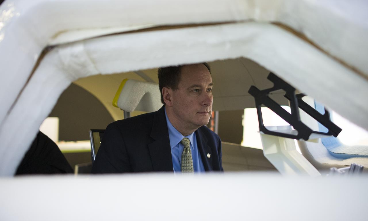 Acting NASA Administrator Robert Lightfoot is seen as he flies the Dream Chaser Space System simulator, Thursday, April 6, 2017 during a visit to Sierra Nevada Corporation in Louisville, Colo.  Photo Credit: (NASA/Joel Kowsky)