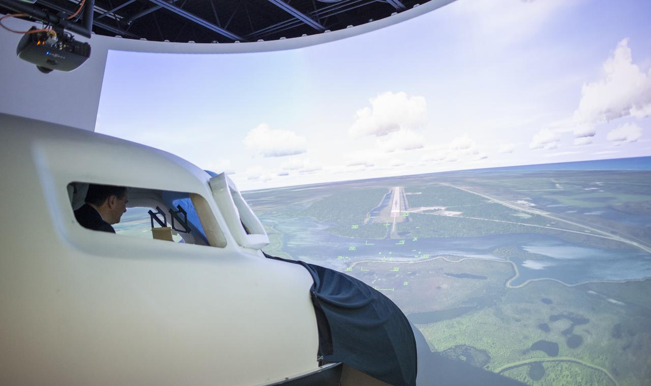 Acting NASA Administrator Robert Lightfoot is seen as he flies the Dream Chaser Space System simulator, Thursday, April 6, 2017 during a visit to Sierra Nevada Corporation in Louisville, Colo. Photo Credit: (NASA/Joel Kowsky)