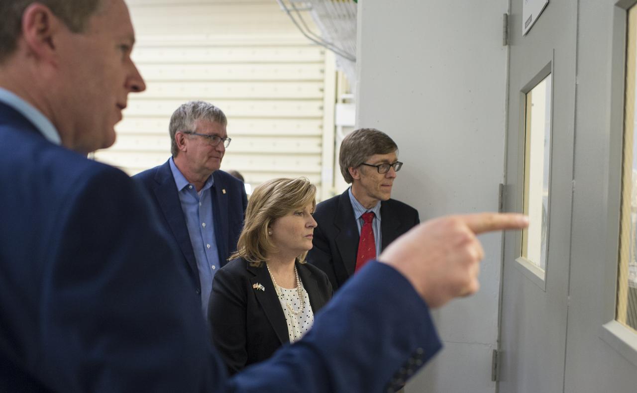 Acting NASA Deputy Administrator Lesa Roe, center, views a clean room with Tim Schoenweis, senior project engineer for the Ozone Mapping Profiler Suite (OMPS) at Ball Aerospace, left, Thursday, April 6, 2017 at Ball Aerospace in Boulder, Colo.  Photo Credit: (NASA/Joel Kowsky)