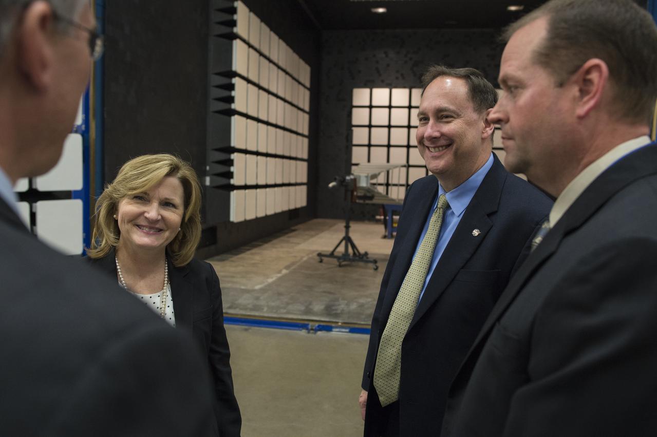 Acting NASA Deputy Administrator Lesa Roe, second from left, and acting NASA Administrator Robert Lightfoot, second from left, are seen with Mike Gazarik, vice president of Engineering at Ball Aerospace, left and Shawn Conley, test operations manager at Ball Aerospace, left, in front of the large semi-anechoic chamber, Thursday, April 6, 2017 during a visit to Ball Aerospace in Boulder, Colo.  Photo Credit: (NASA/Joel Kowsky)
