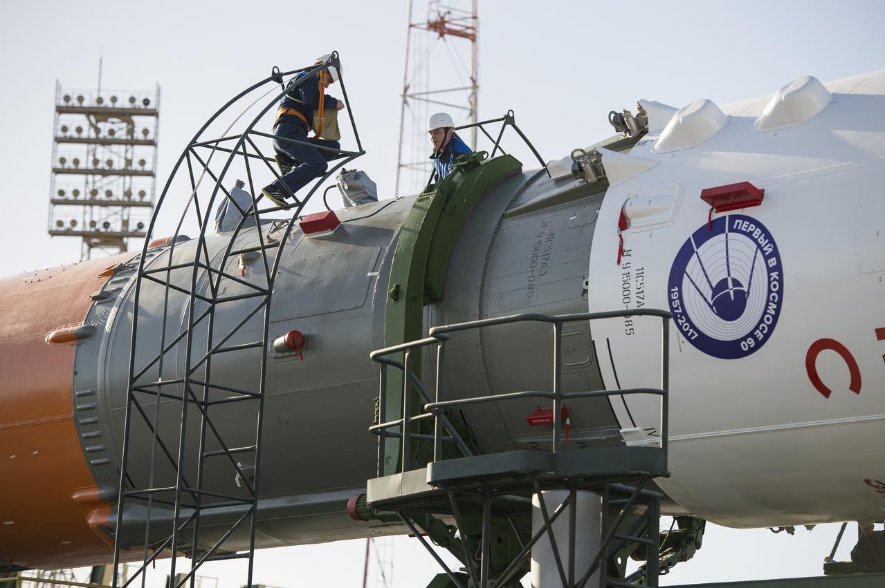 Workers prepare to raise the Soyuz MS-04 spacecraft into the vertical position on Monday, April 17, 2017 at the Baikonur Cosmodrome in Kazakhstan. Launch of the Soyuz rocket is scheduled for April 20 Baikonur time and will carry Expedition 51 Soyuz Commander Fyodor Yurchikhin of Roscosmos and Flight Engineer Jack Fischer of NASA into orbit to begin their four and a half month mission on the International Space Station. Photo Credit: (NASA/Aubrey Gemignani)