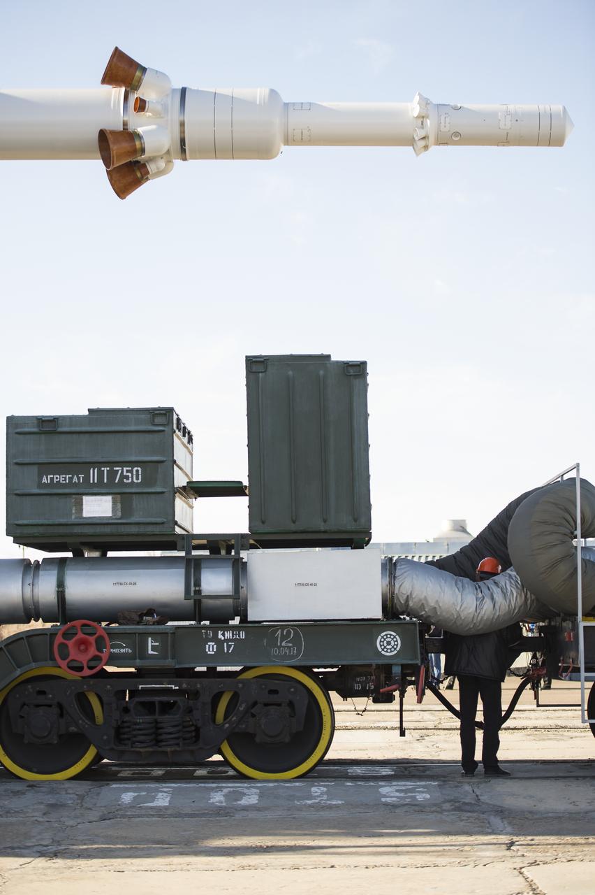 The escape tower is seen as workers prepare to raise the Soyuz MS-04 spacecraft into the vertical position on Monday, April 17, 2017 at the Baikonur Cosmodrome in Kazakhstan. Launch of the Soyuz rocket is scheduled for April 20 Baikonur time and will carry Expedition 51 Soyuz Commander Fyodor Yurchikhin of Roscosmos and Flight Engineer Jack Fischer of NASA into orbit to begin their four and a half month mission on the International Space Station. Photo Credit: (NASA/Aubrey Gemignani)