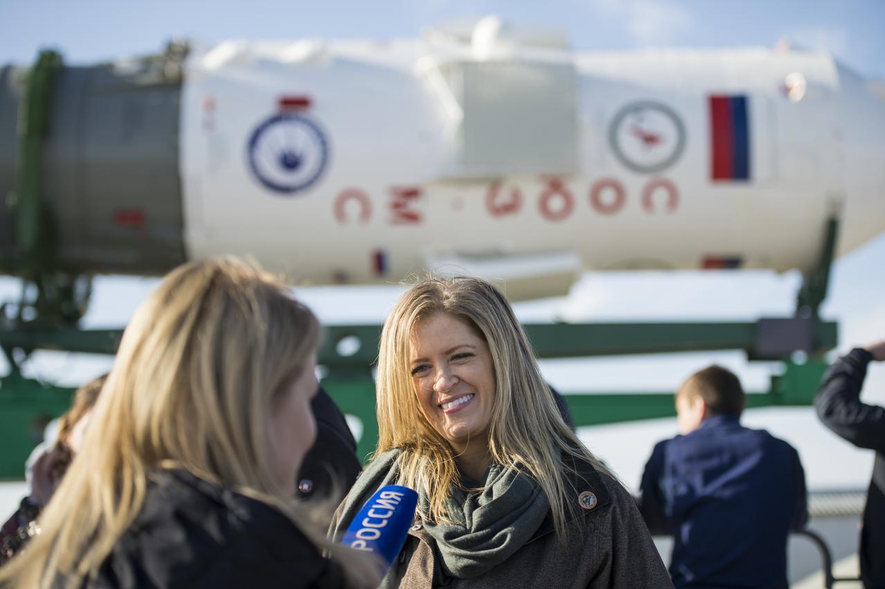 Elizabeth Fischer, wife of Expedition 51 Flight Engineer Jack Fischer of NASA is interviewed by media shortly after the Soyuz MS-04 spacecraft arrived at the launch pad by train on Monday, April 17, 2017 at the Baikonur Cosmodrome in Kazakhstan. Launch of the Soyuz rocket is scheduled for April 20 and will carry Fischer and Soyuz Commander Fyodor Yurchikhin of Roscosmos into orbit to begin their four and a half month mission on the International Space Station.Photo Credit: (NASA/Aubrey Gemignani)