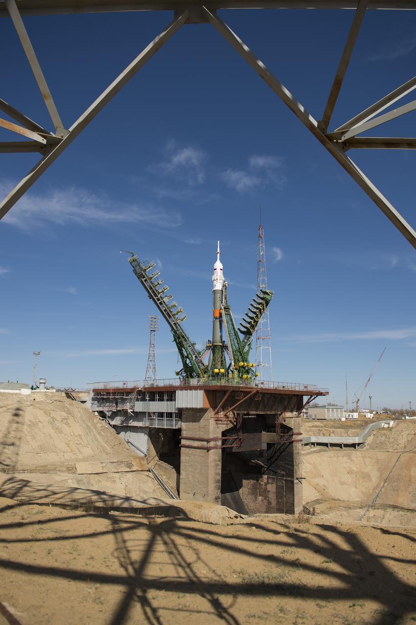 The gantry arms close around the Soyuz MS-04 spacecraft to secure the rocket at the launch pad on Monday, April 17, 2017 at the Baikonur Cosmodrome in Kazakhstan. Launch of the Soyuz rocket is scheduled for April 20 Baikonur time and will carry Expedition 51 Soyuz Commander Fyodor Yurchikhin of Roscosmos and Flight Engineer Jack Fischer of NASA into orbit to begin their four and a half month mission on the International Space Station. Photo Credit: (NASA/Aubrey Gemignani)